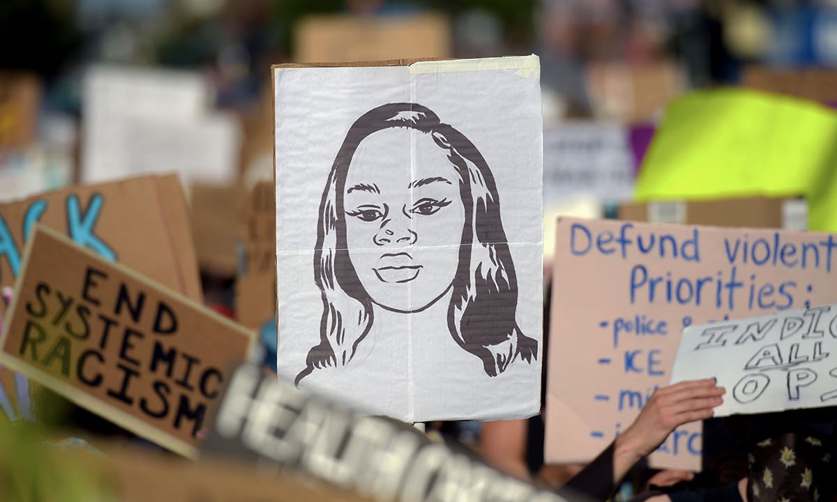 Breonna Taylor sign in protest crowd