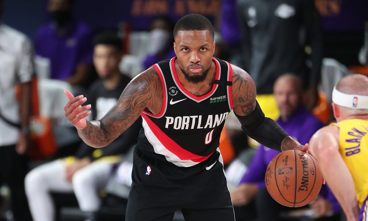 Damian Lillard #0 of the Portland Trail Blazers handles the ball against the Los Angeles Lakers during Round One, Game One of the NBA Playoffs