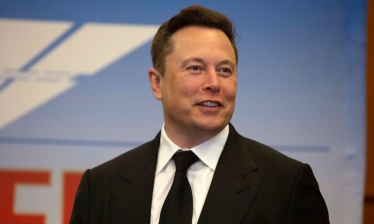 Elon Musk suit tie smiling