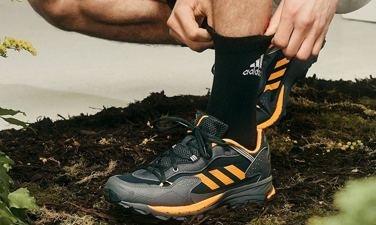 on-foot view of adidas Response Hoverturf in black and yellow