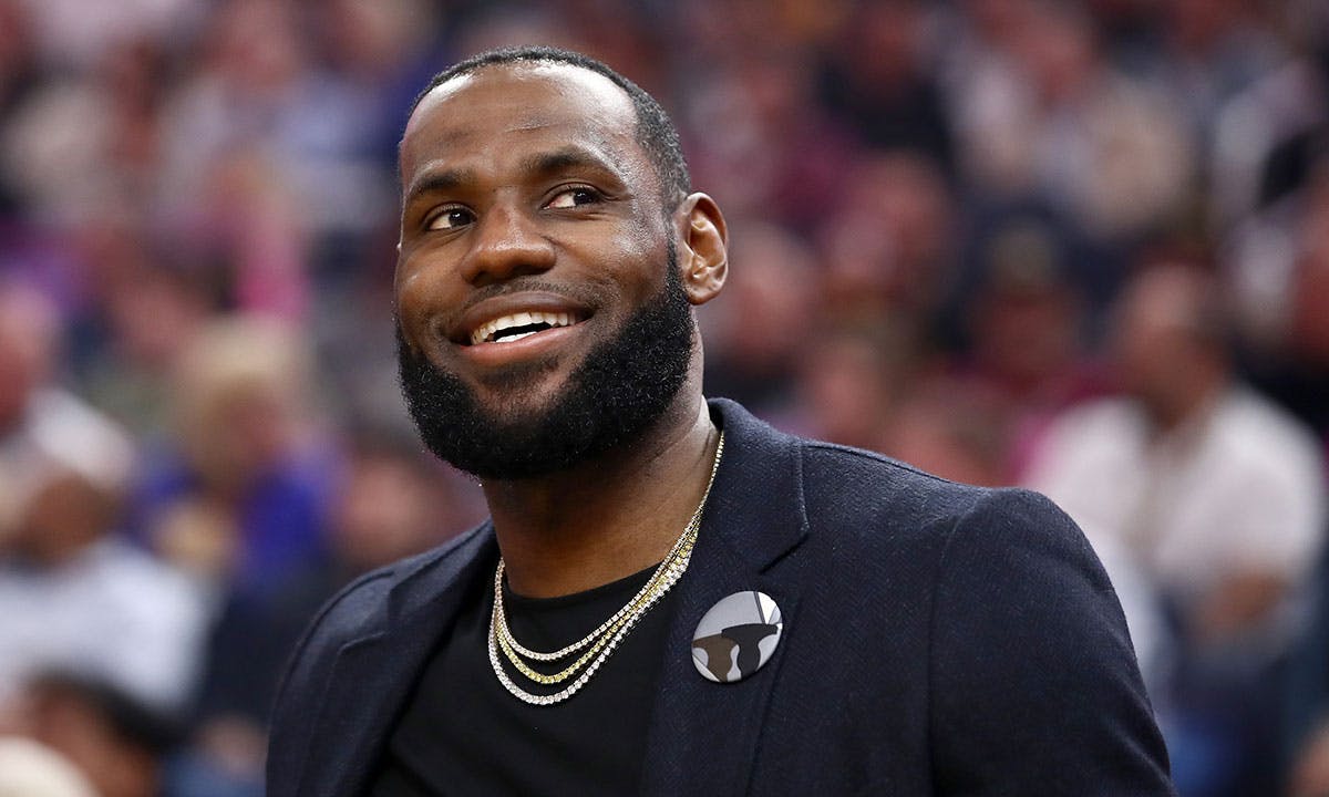 LeBron James #23 of the Los Angeles Lakers sits on the bench injured during their game against the Golden State Warriors at Chase Center on February 27