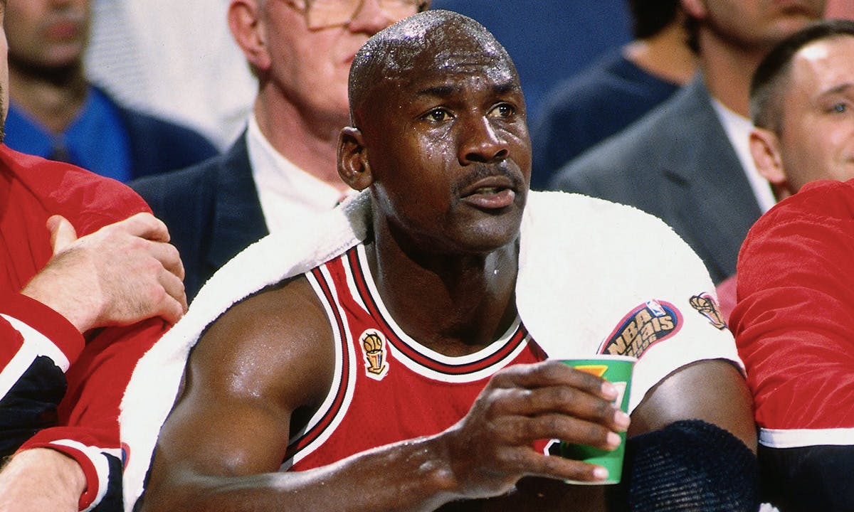 Michael Jordan sitting court-side during his famous "flu game"