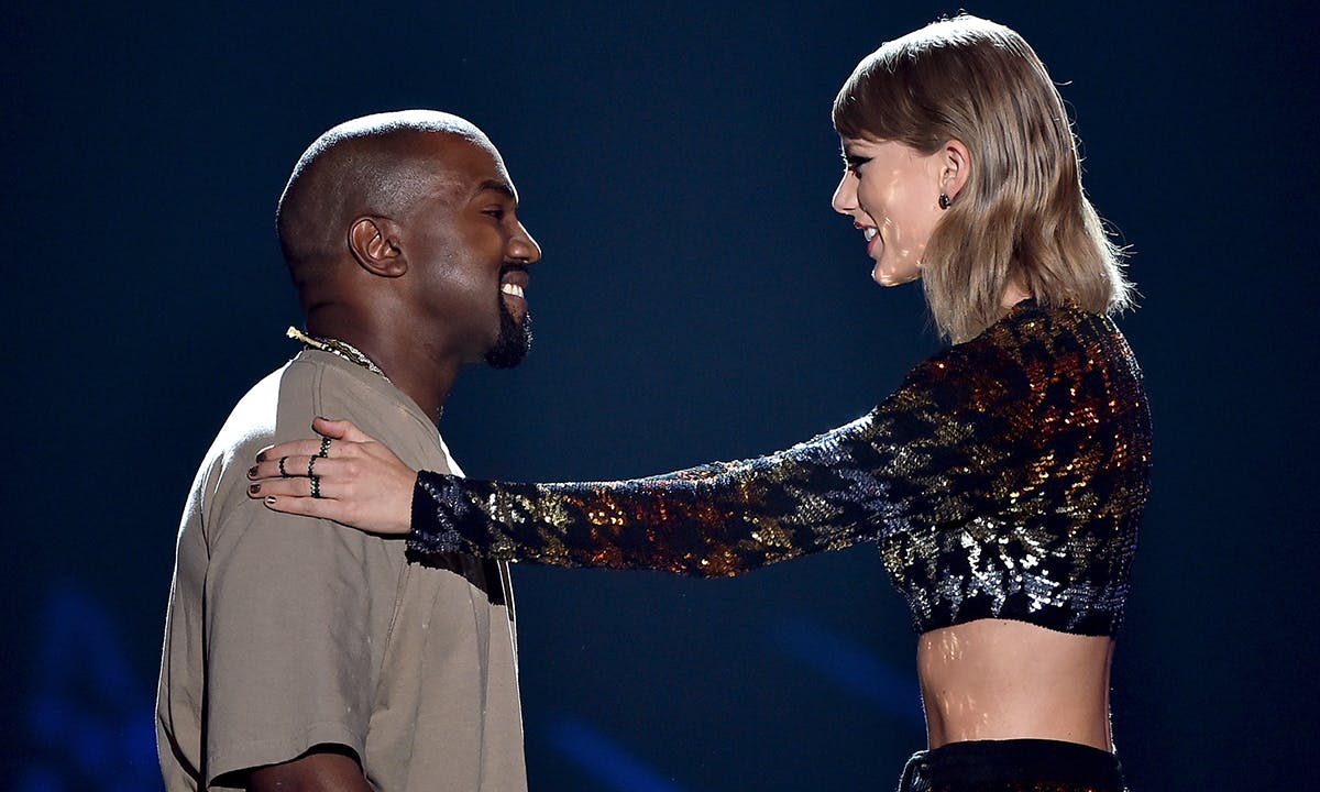 Kanye West accepts the Video Vanguard Award from recording artist Taylor Swift