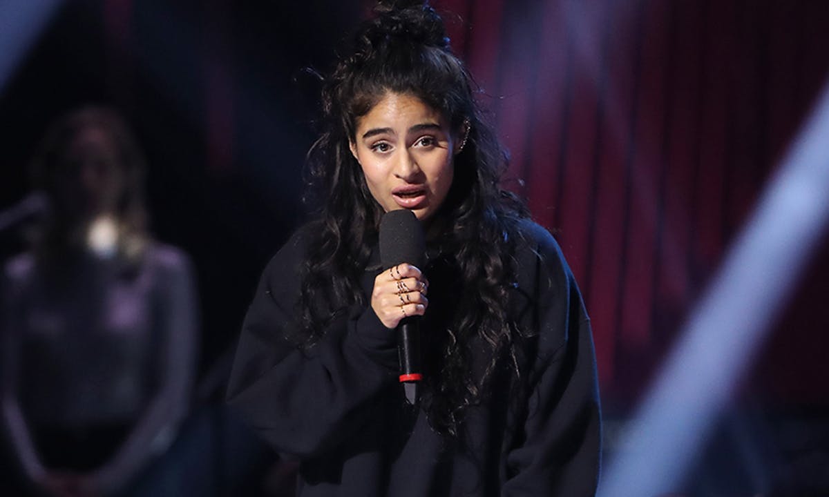 Jessie Reyez speaks after receiving an award