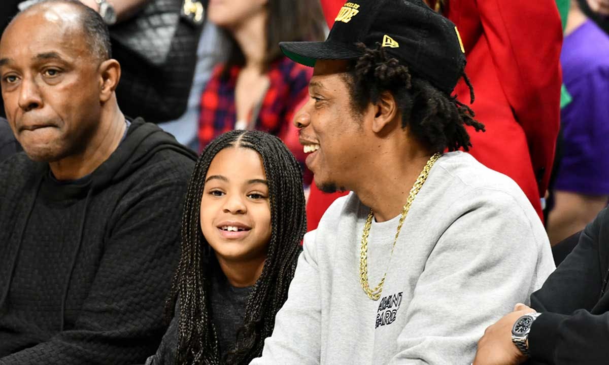 Jay-Z and Blue Ivy Carter attend a basketball game between the Los Angeles Clippers and the Los Angeles Lakers at Staples Center