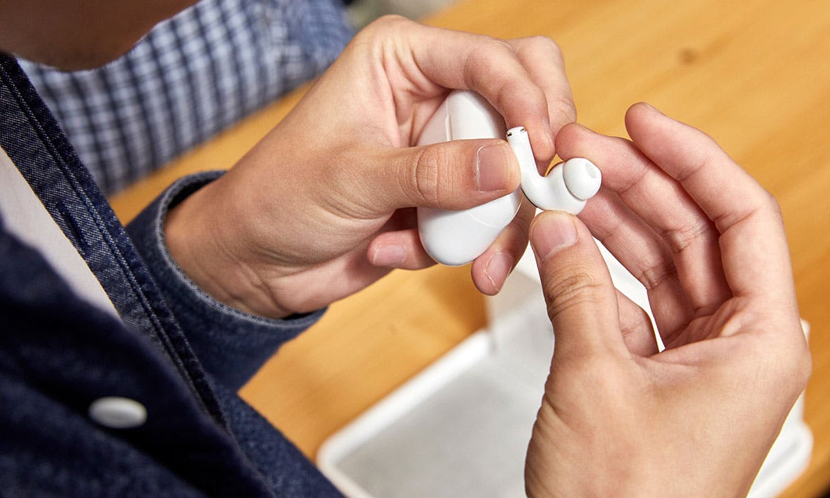 customer holds apple AirPods pro