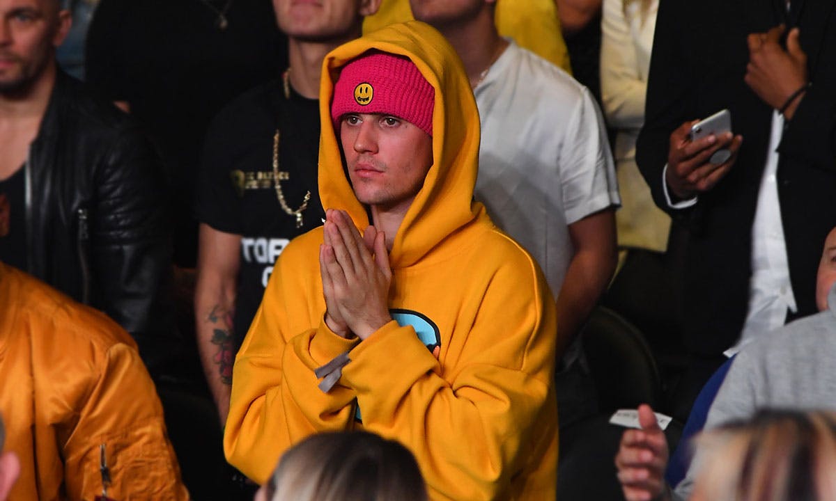 Justin Bieber stands amid crowd