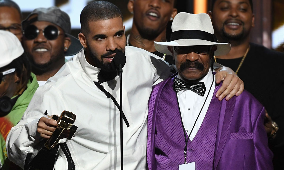 Drake and father Dennis Graham accepting award