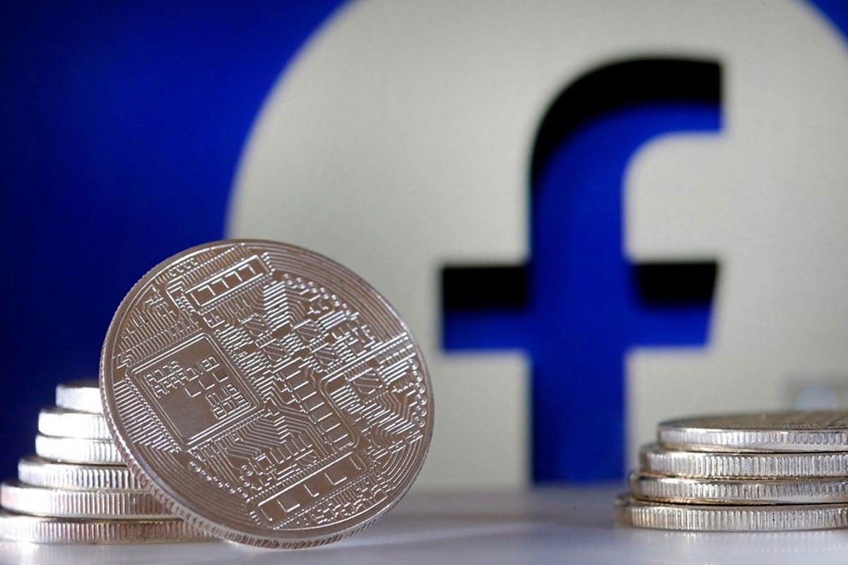 facebook icon behind stack of coins