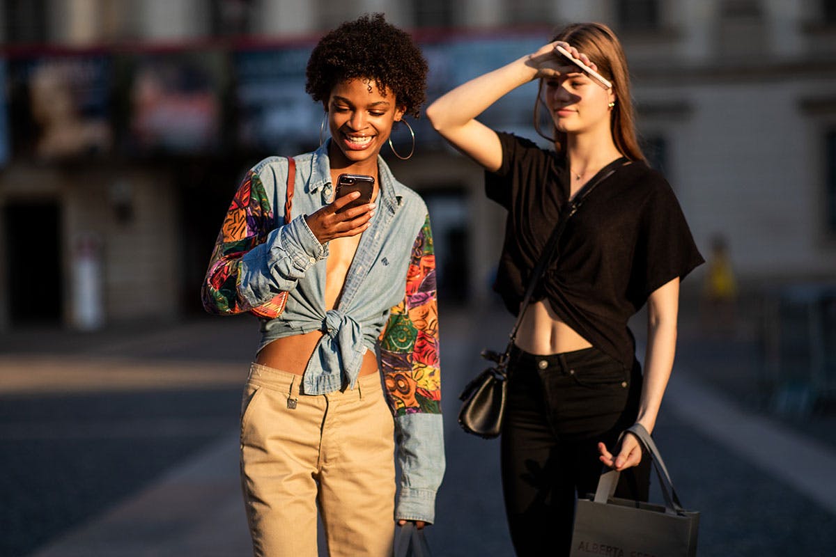 woman texting smiling