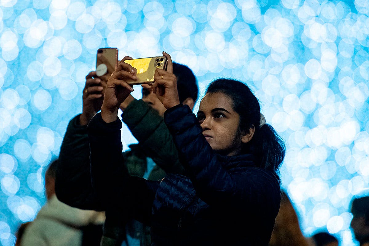 Woman takes photo with iPhone