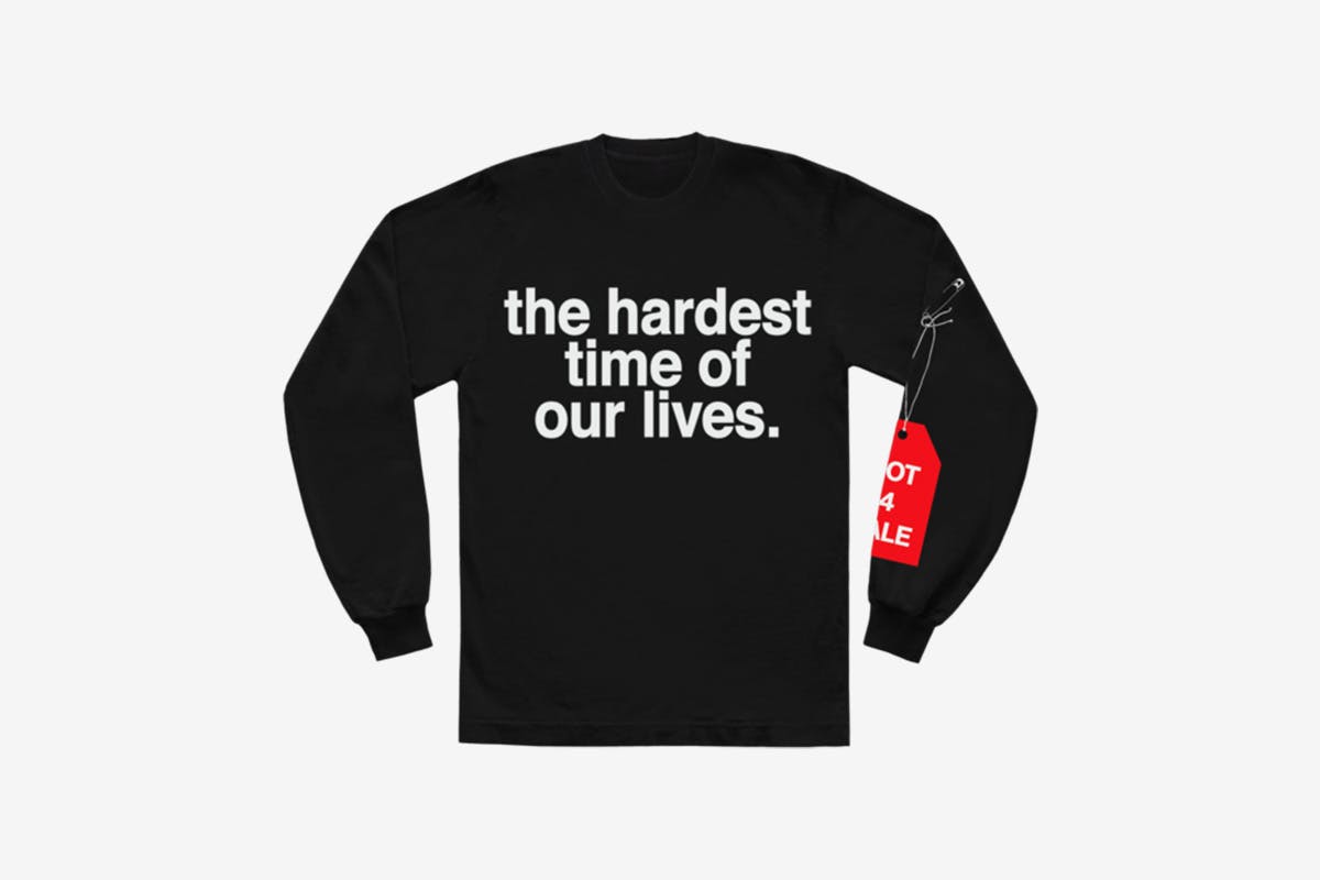 image of Andre' 3000's new sweater with slogan from tour jumpsuits