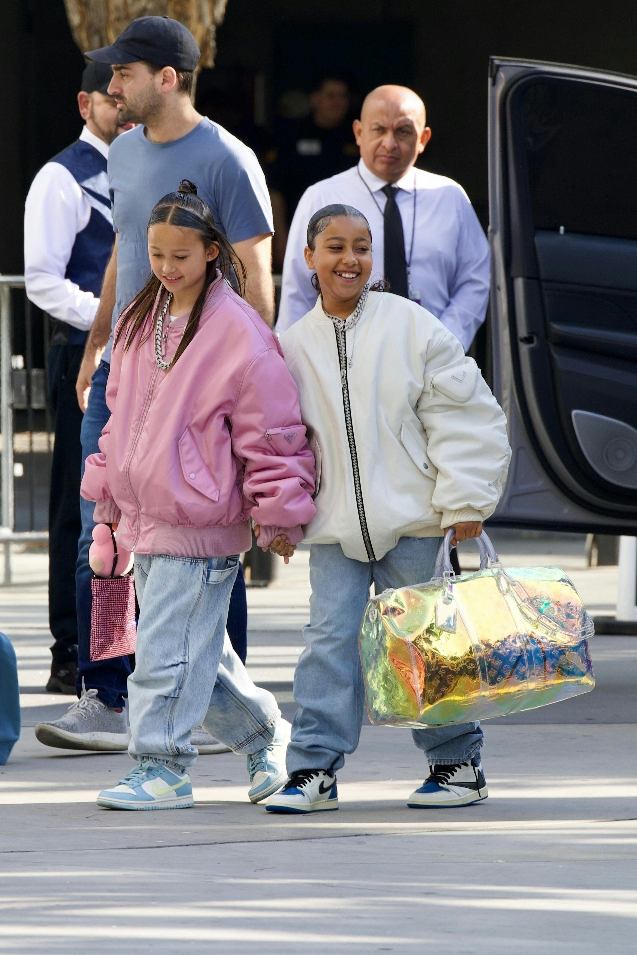 north west wearing prada bomber jacket