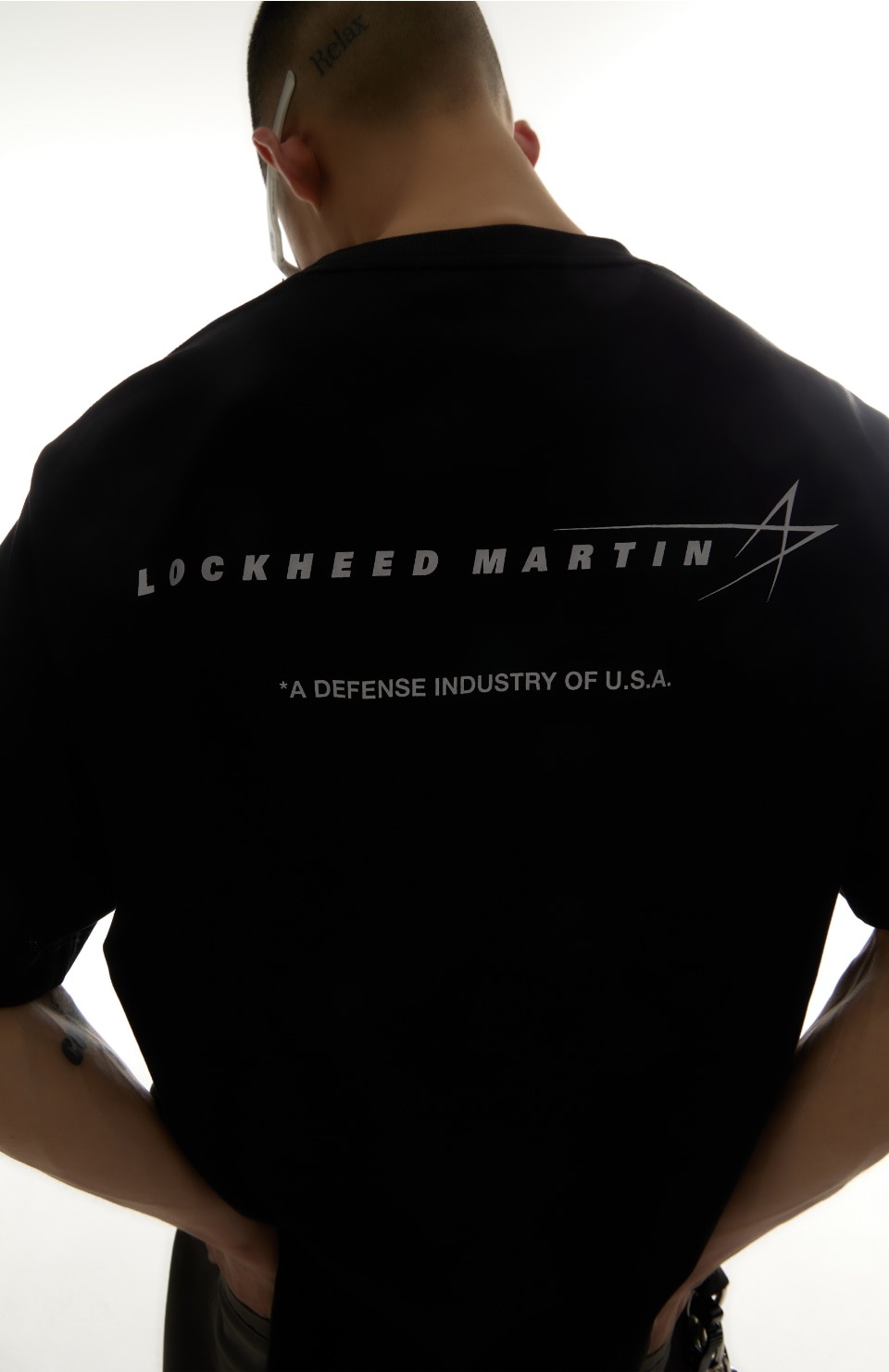 A black T-shirt by Lockheed Martin, the Korean streetwear brand