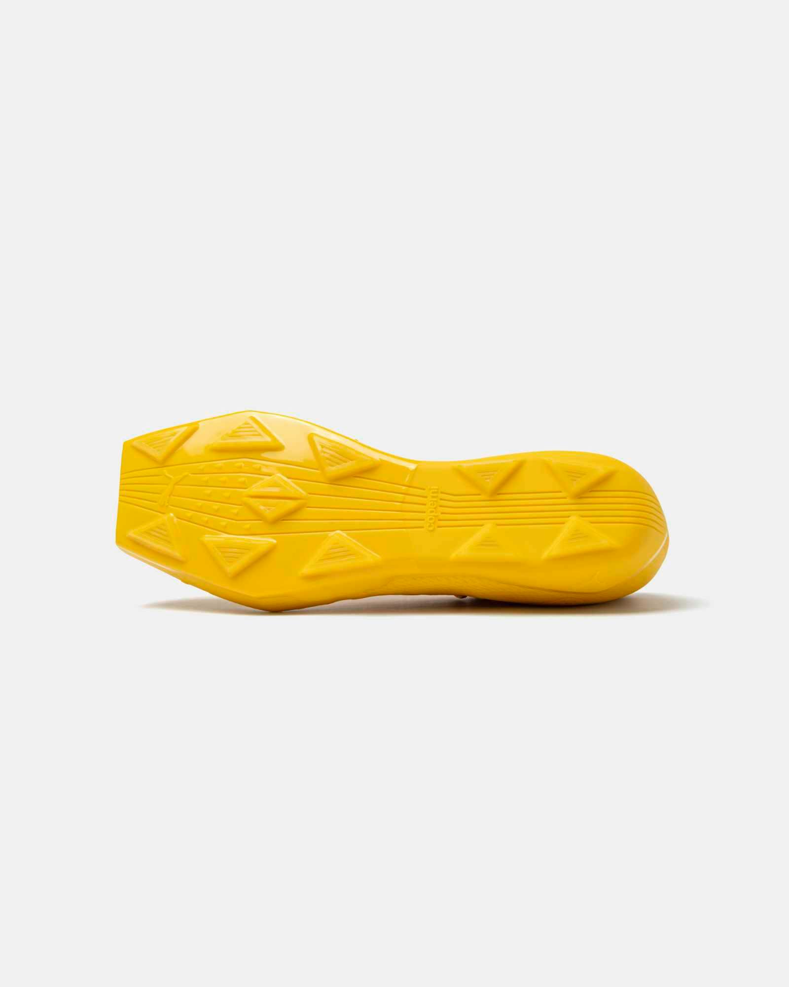 Product photos of Coperni & PUMA's collaborative sneaker in black, white and yellow colorways