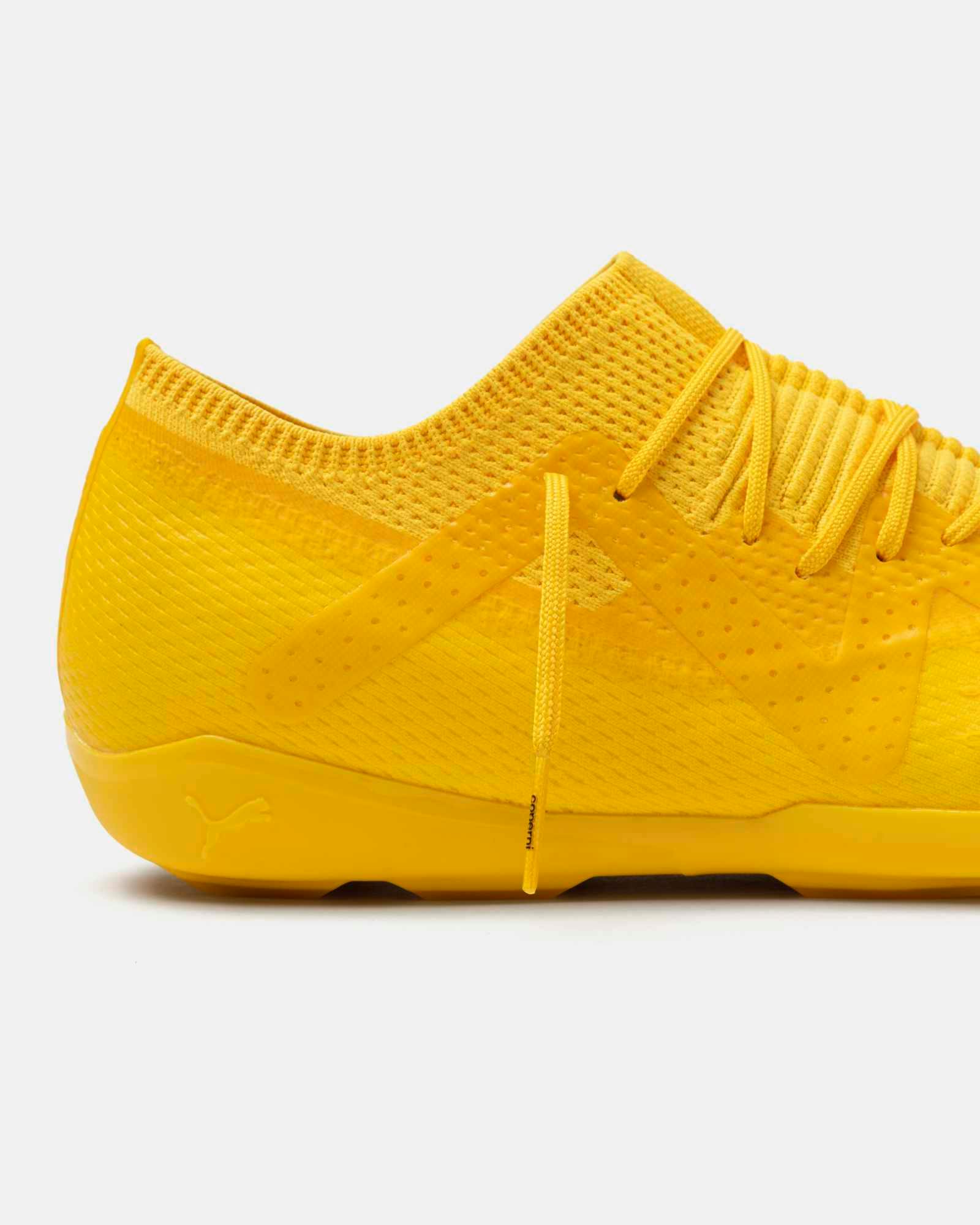 Product photos of Coperni & PUMA's collaborative sneaker in black, white and yellow colorways