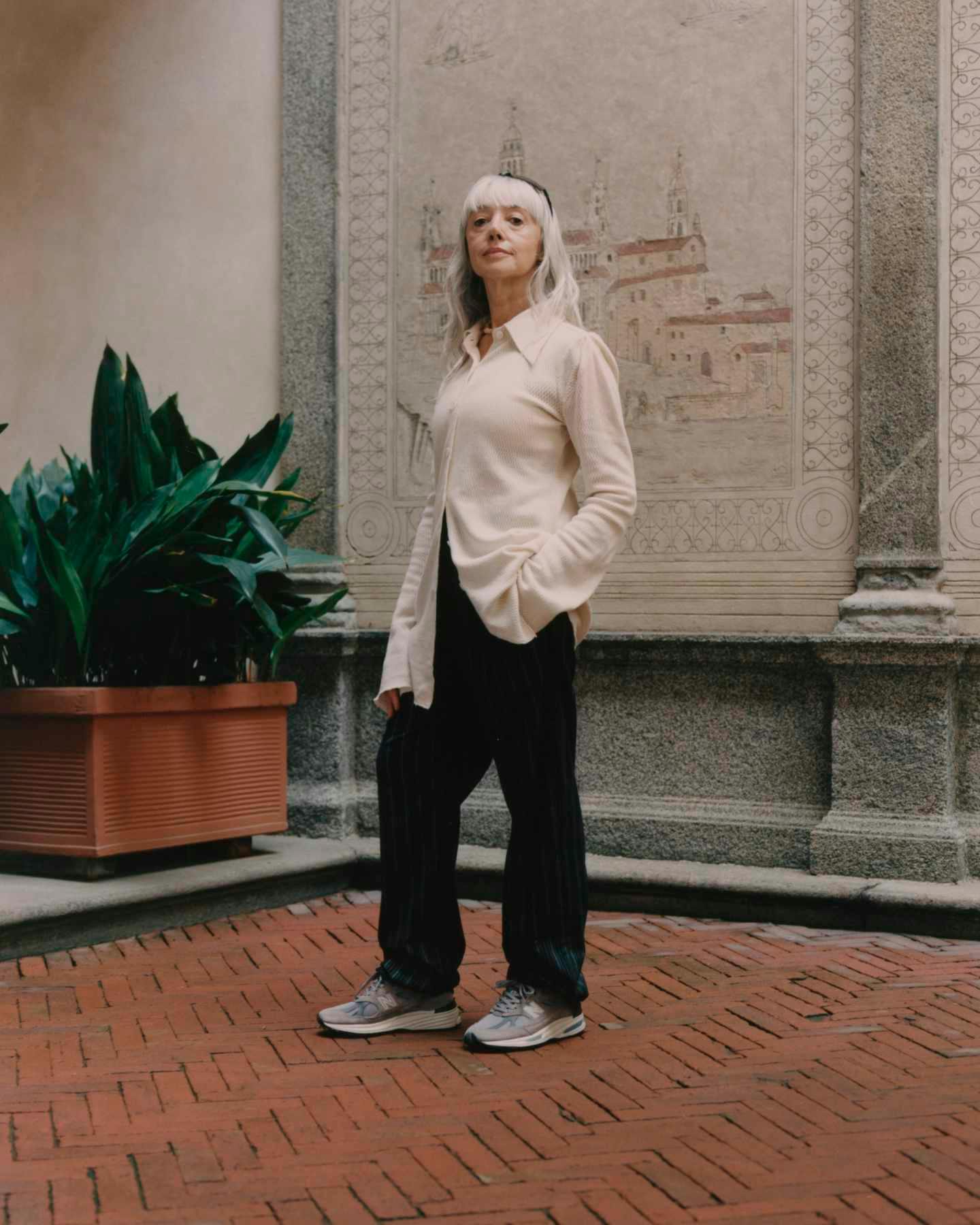 Lifestyle photos showing Italians wearing New Balance's grey suede 991v2 sneaker