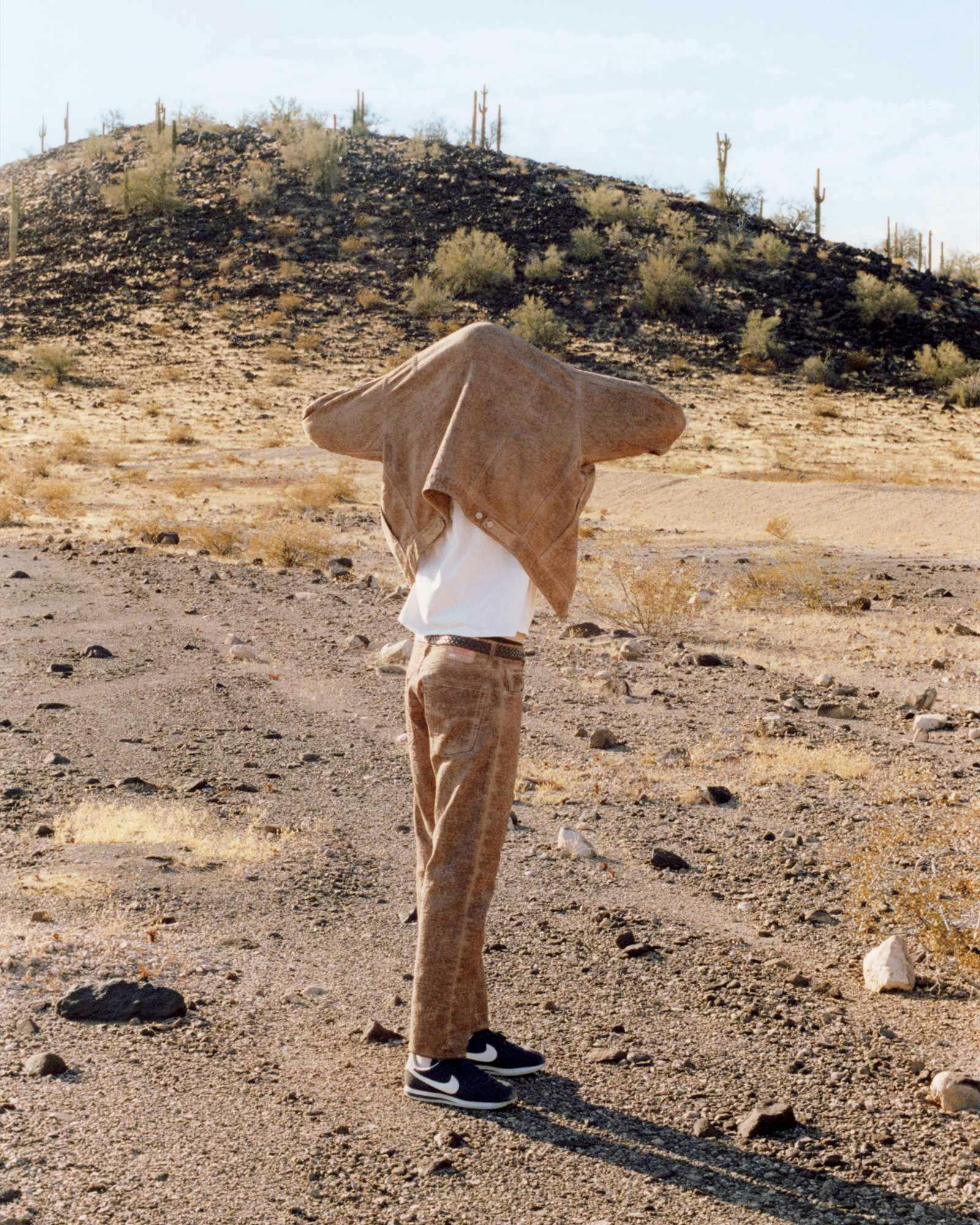 Models wear Stussy & Levi's overdyed brown, beige, and grey denim trucker jackets and 501 jeans