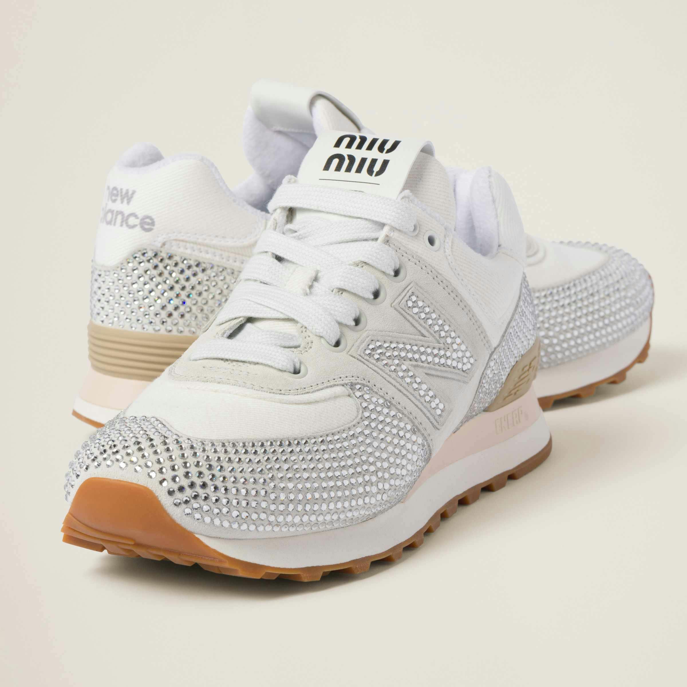 Miu Miu's New Balance 574 sneaker in white suede & denim with crystals