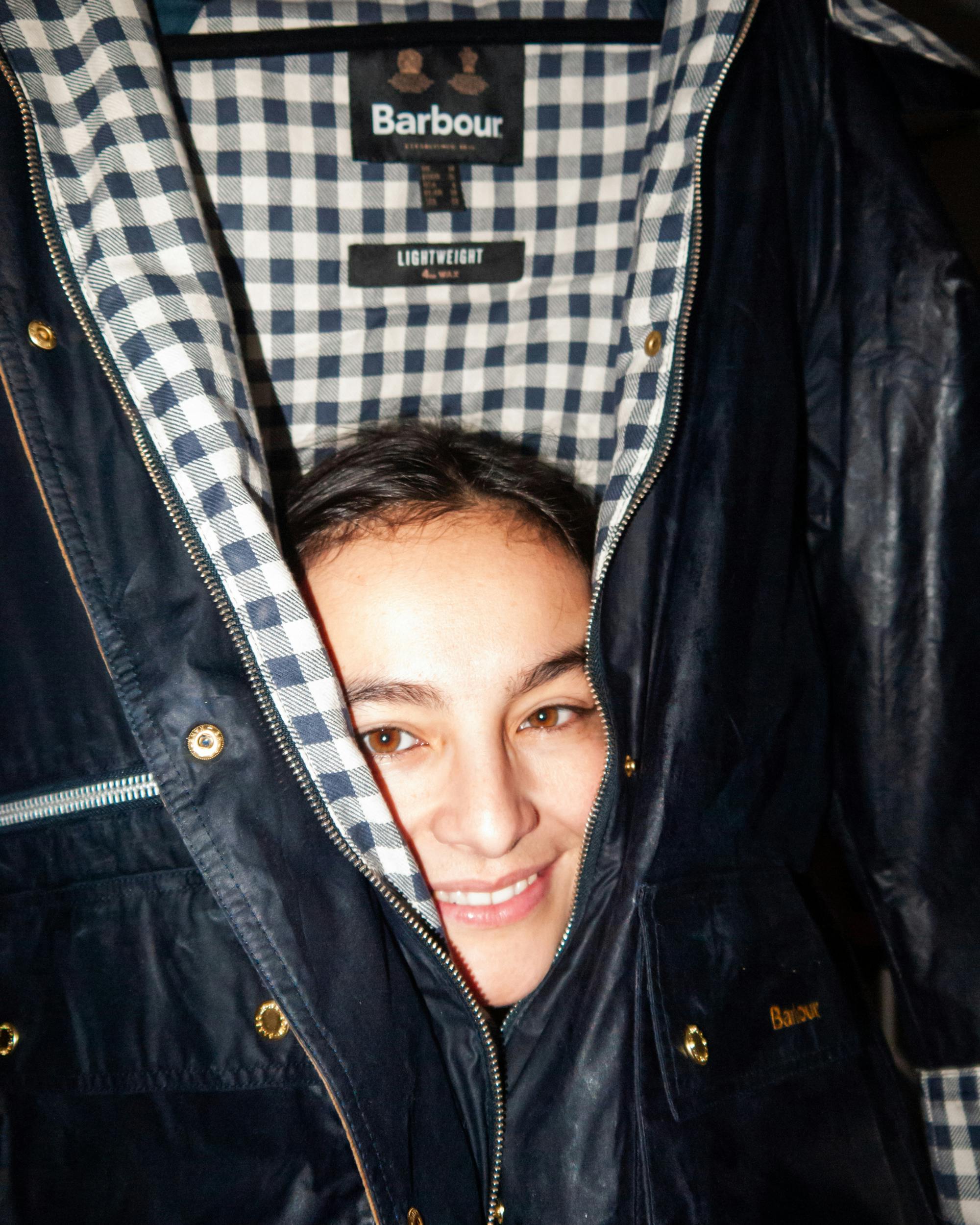 Dani posing with her Barbour jacket during the re-waxing process