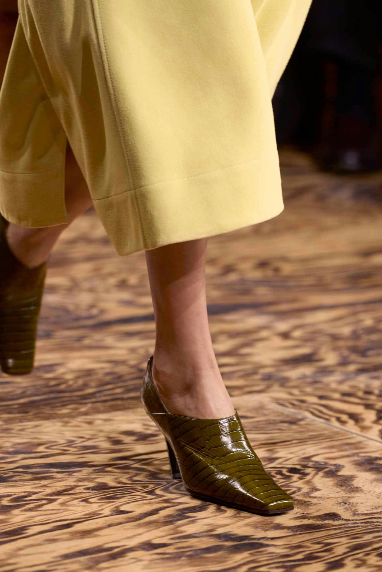 Models wear Bottega Veneta's green Fall/Winter 2024 clothes during Milan Fashion Week FW24