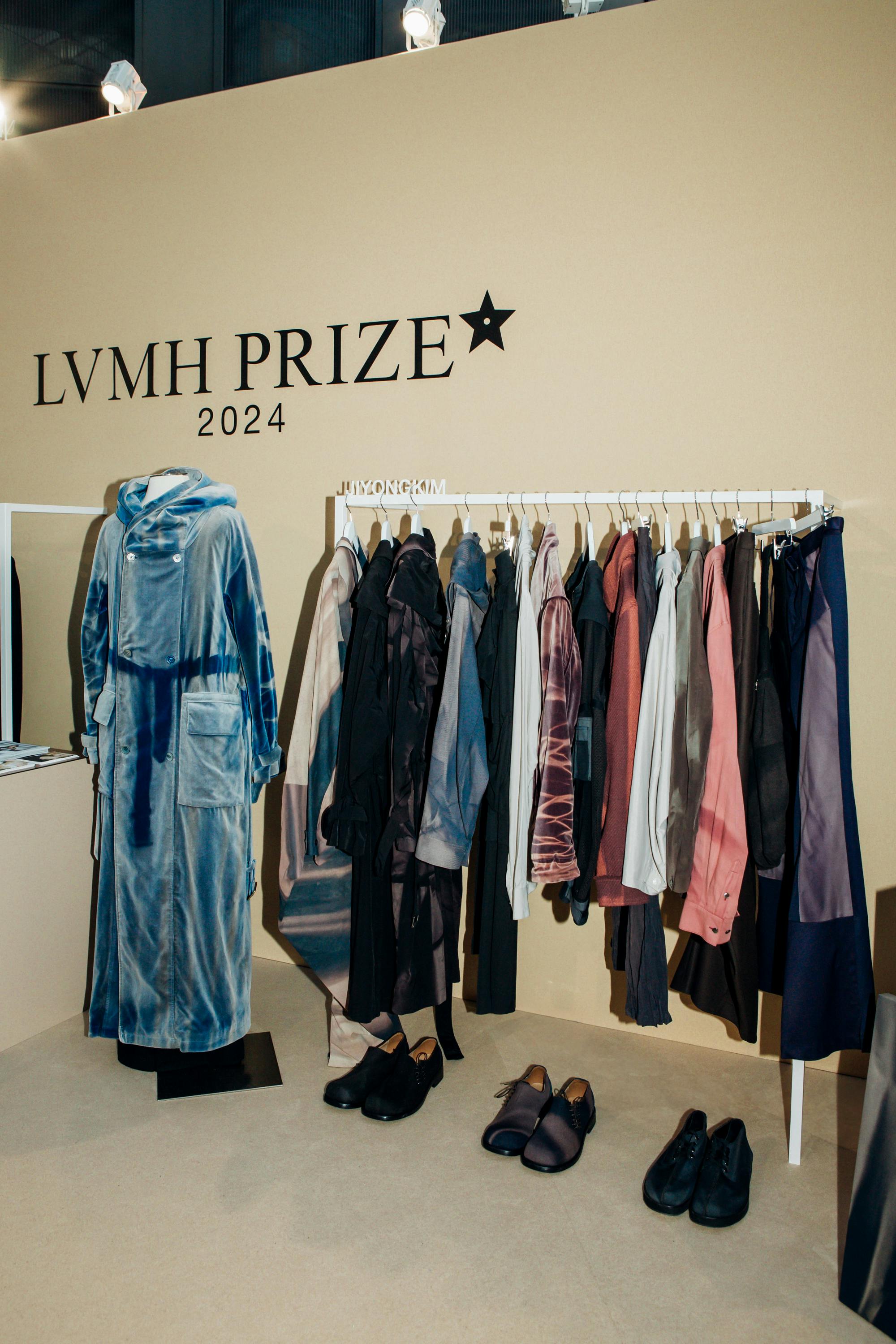 Designer JiyongKim seen holding his clothes at the 2024 LVMH Prize