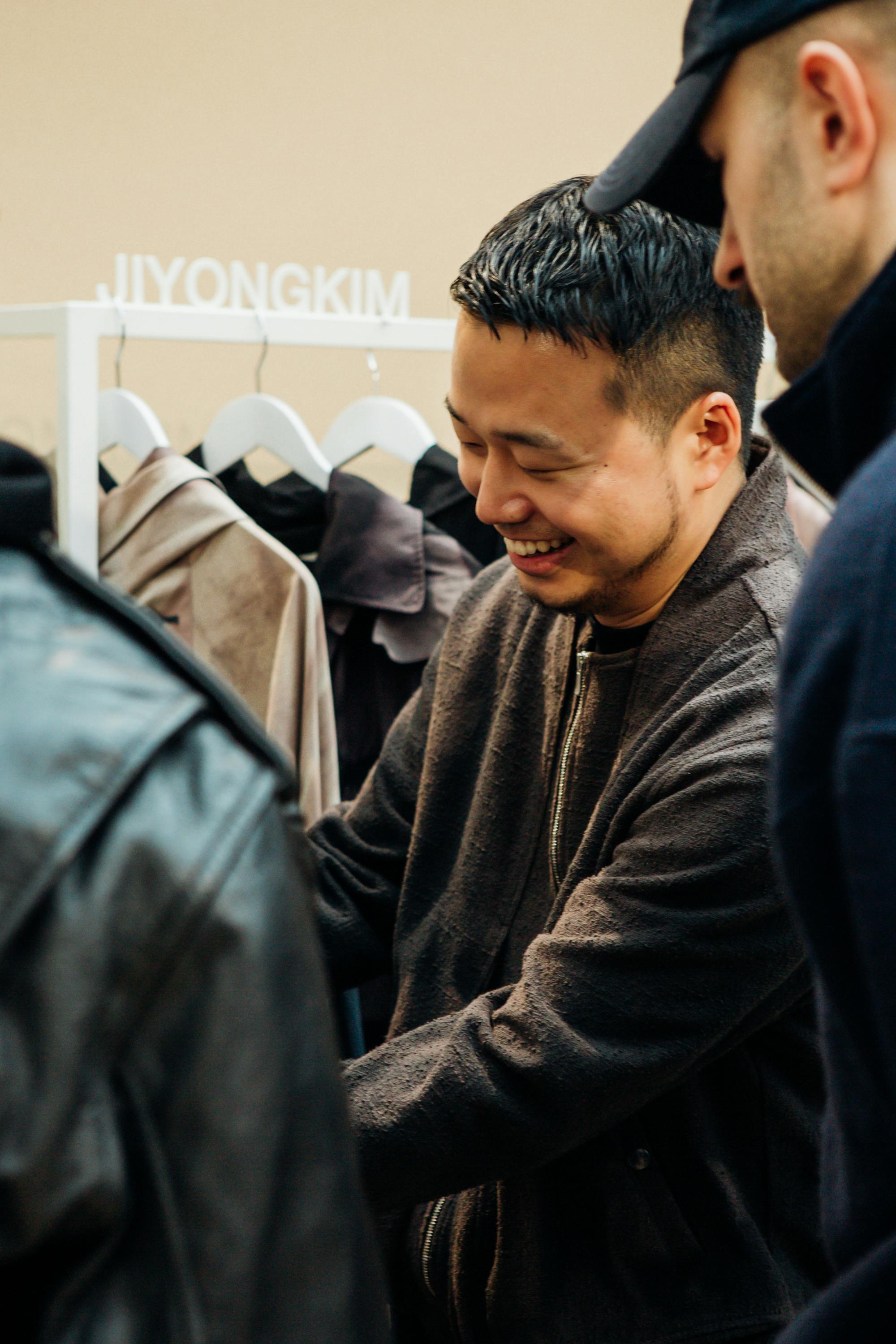 Designer JiyongKim seen holding his clothes at the 2024 LVMH Prize