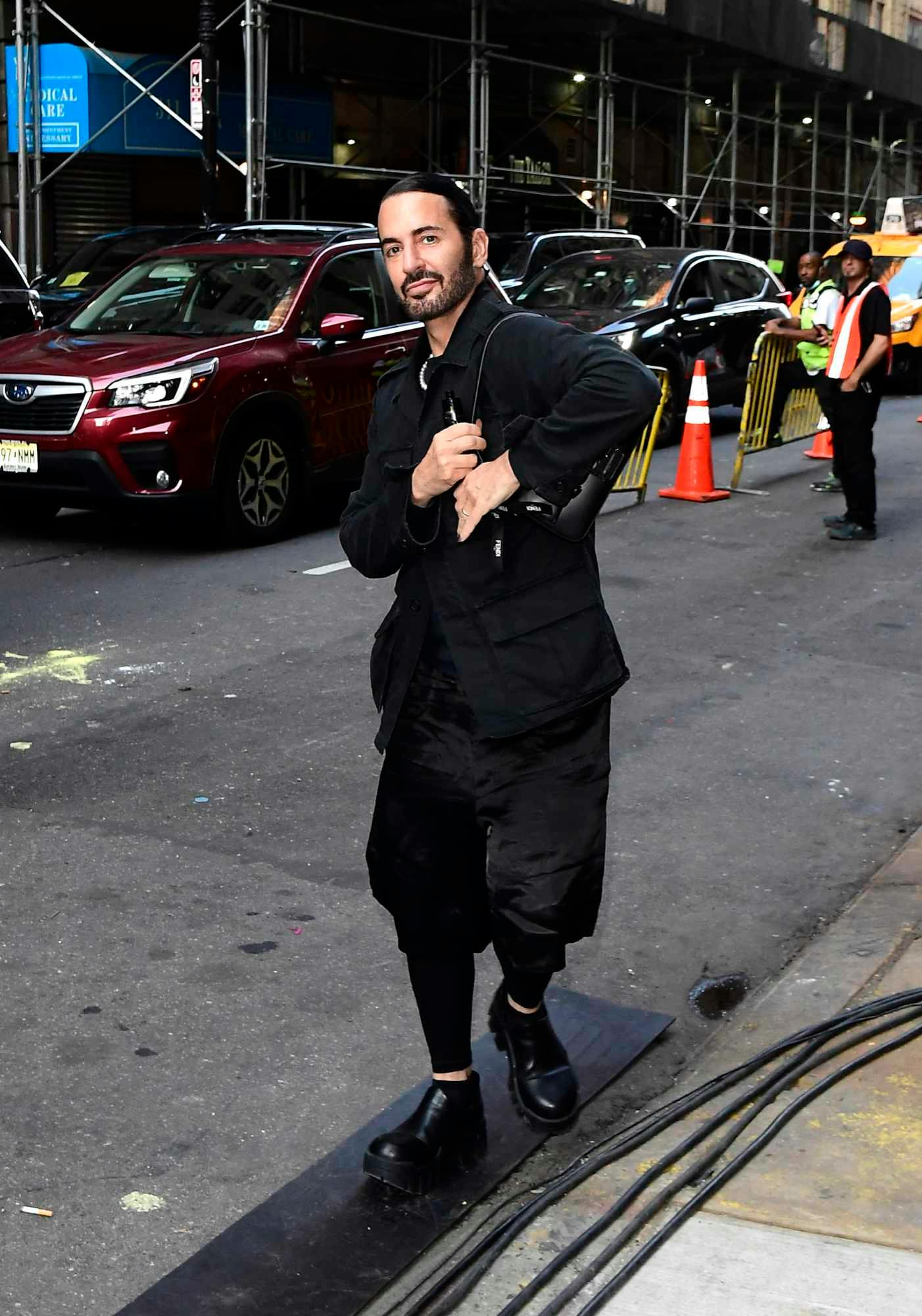 Designer Marc Jacobs wears a black outfit with a dark Fendi handbag in New York