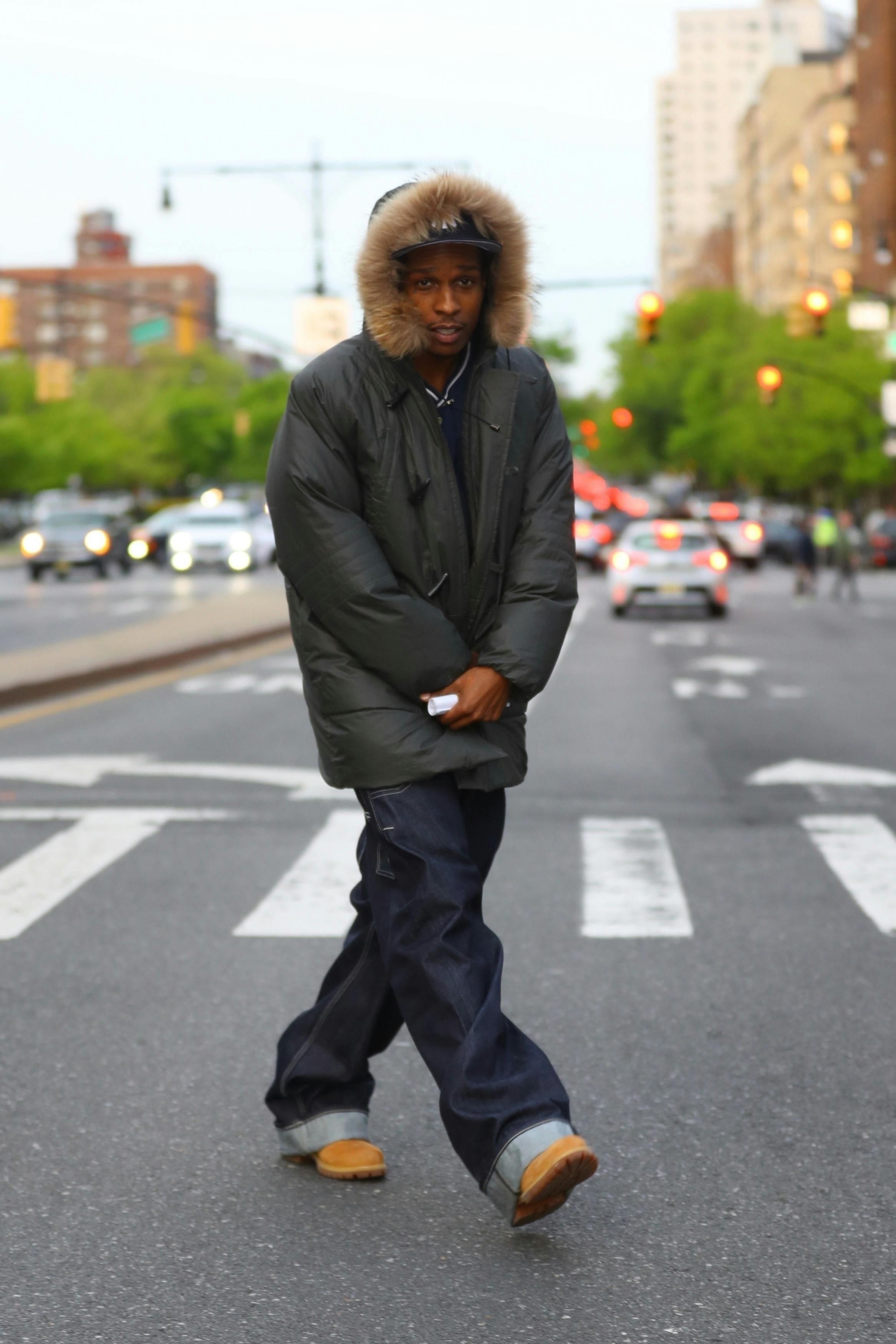 A$AP Rocky wears a fur-hooded coat, baggy jeans, and timberland boots on the set of Spike Lee's new movie