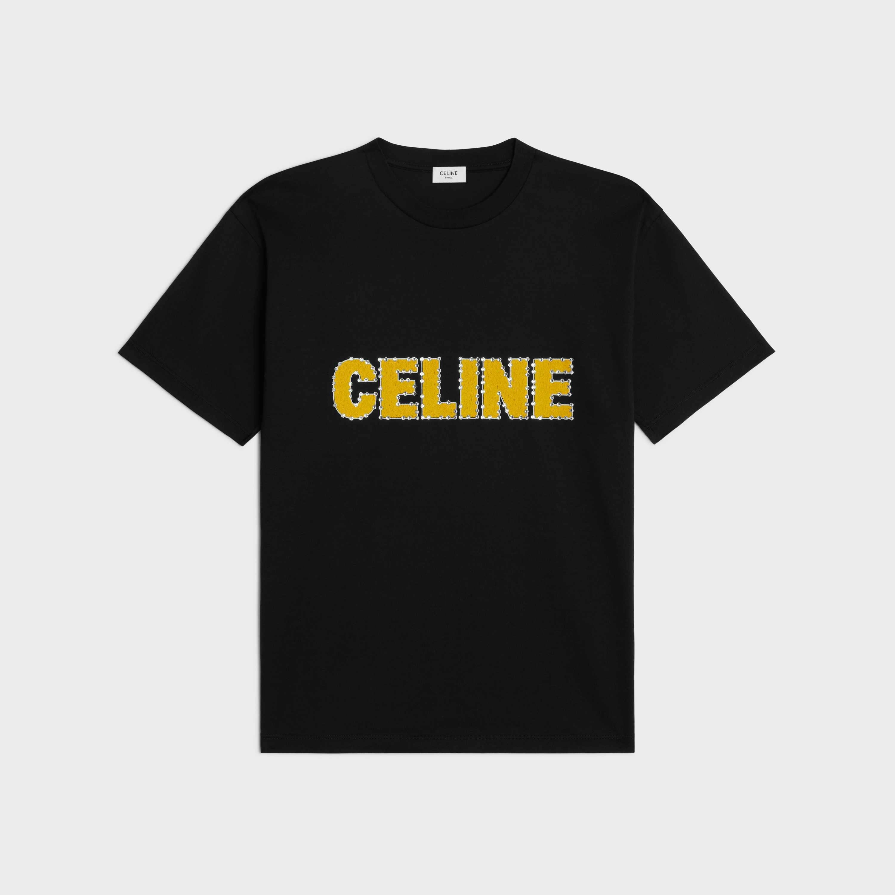 CELINE's Surf menswear capsule, including shirts, glasses, shoes, sneakers, bags, and surfboard