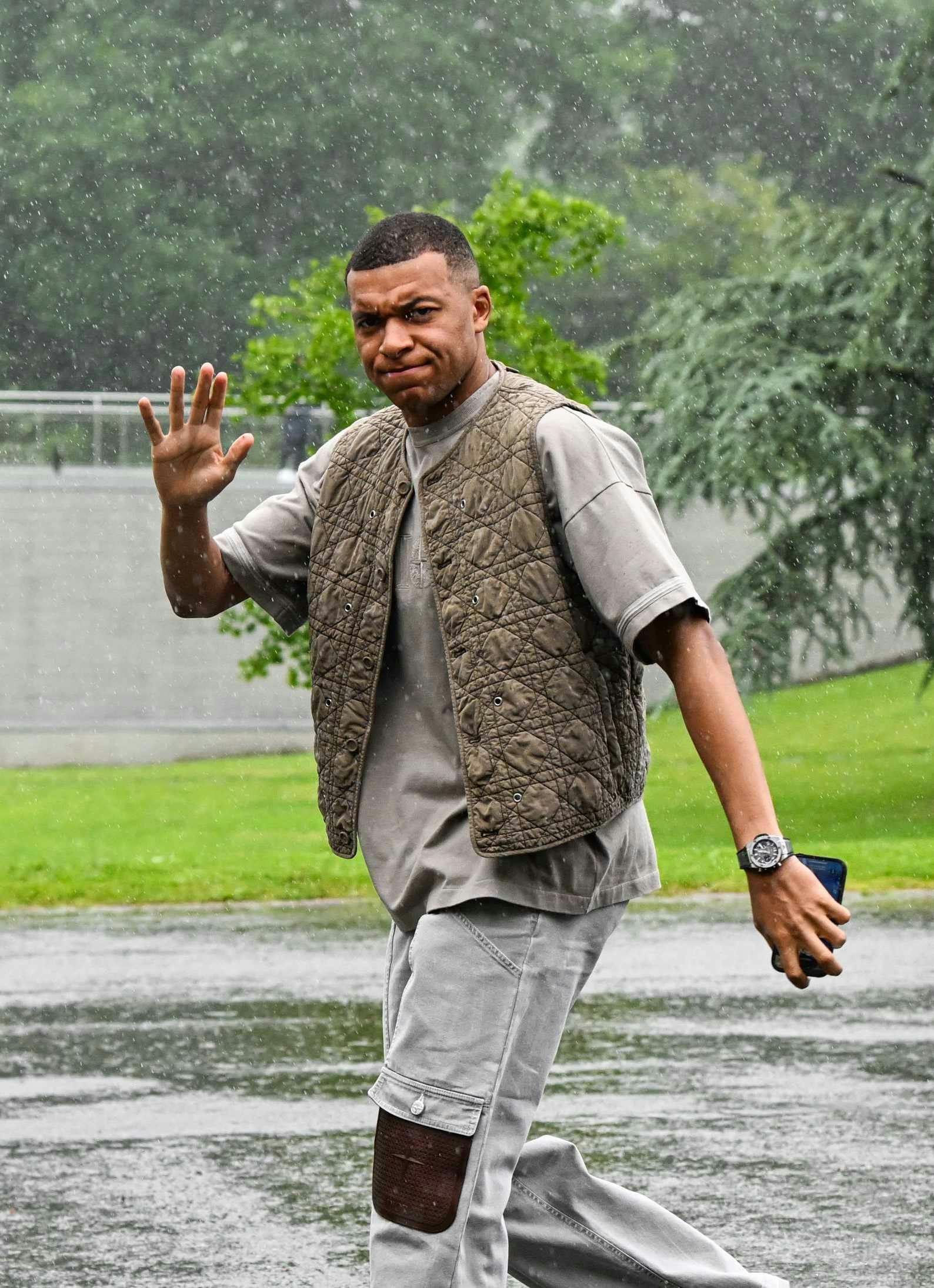 Kylian Mbappe & Bradley Barcola wear Stone Island x Dior green vest, garment-dyed T-shirt, black silk suit with collaborative badge logo