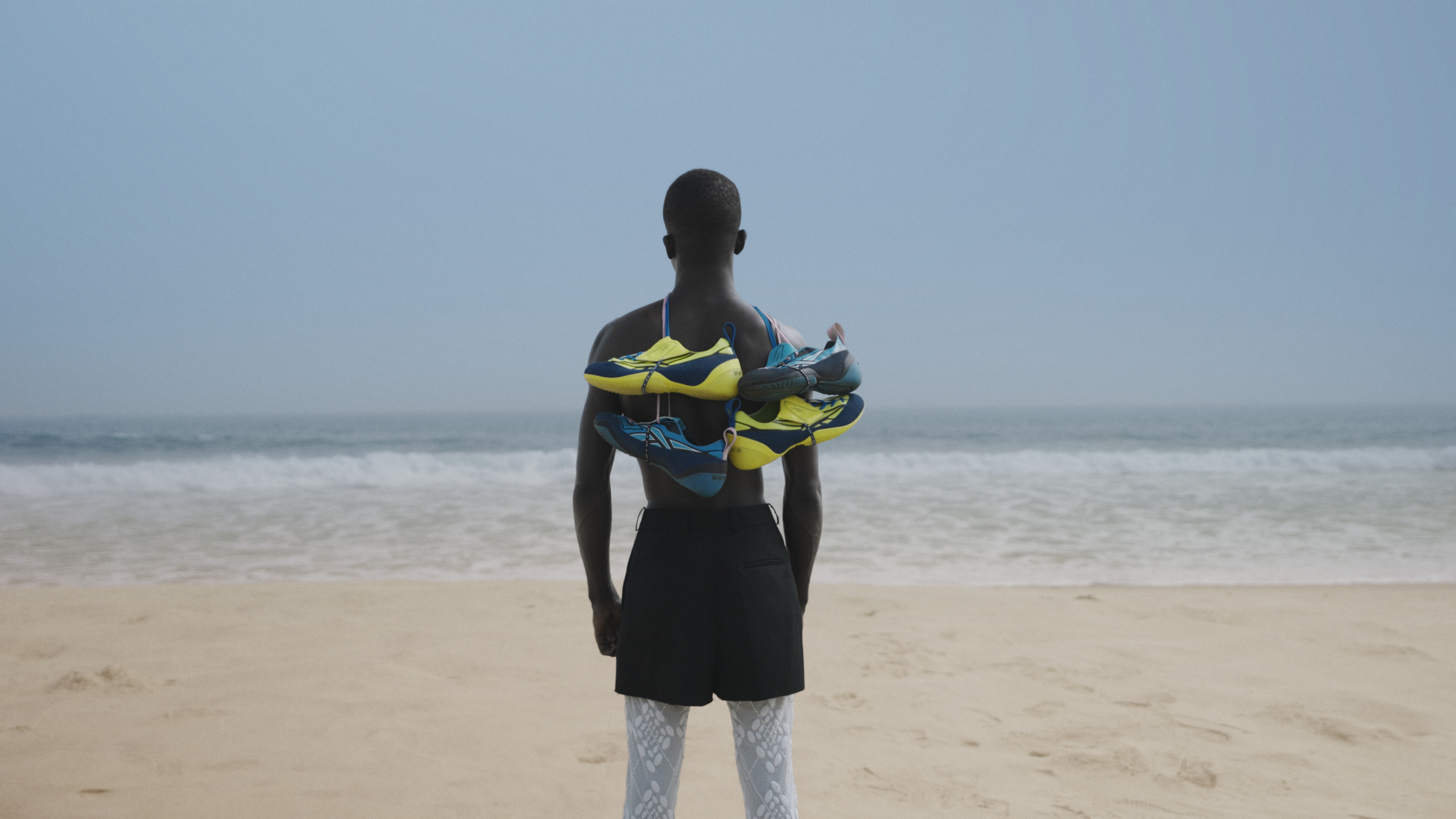Botter's Reebok football sneaker collab seen on models on a beach