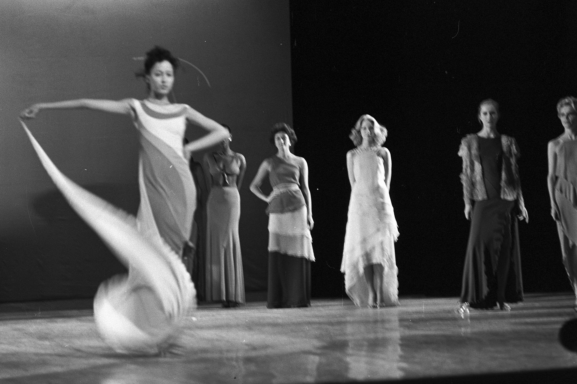 Models dressed in gowns take the stage during the fashion show to benefit the restoration of the Chateau of Versailles, five American designers matching talents with five French couturiers at the Versailles Palace on November 28, 1973 in Versailles, France...Article title: 'One night and pouf! It's gone! (Photo by Fairchild Archive/Penske Media via Getty Images)