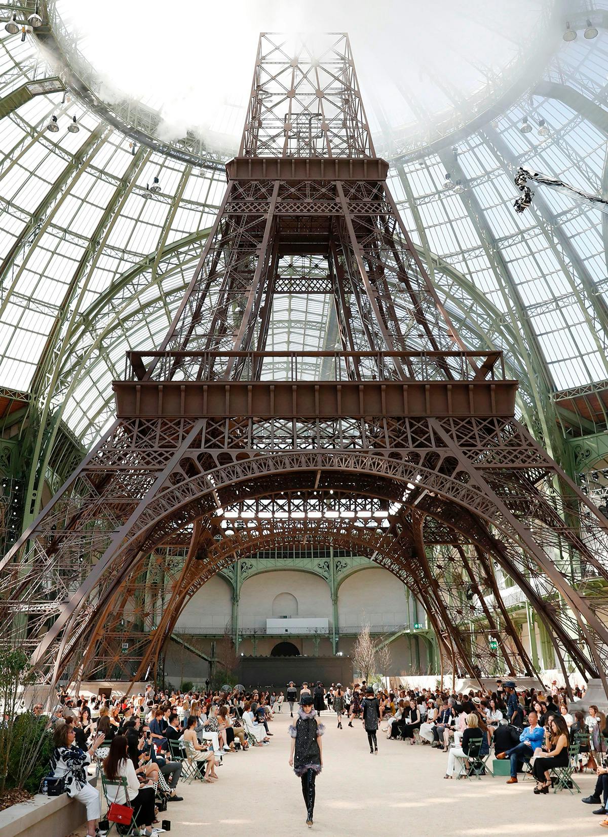 A model presents a creation for Chanel during the 2017-2018 fall/winter Haute Couture collection in Paris on July 4, 2017.