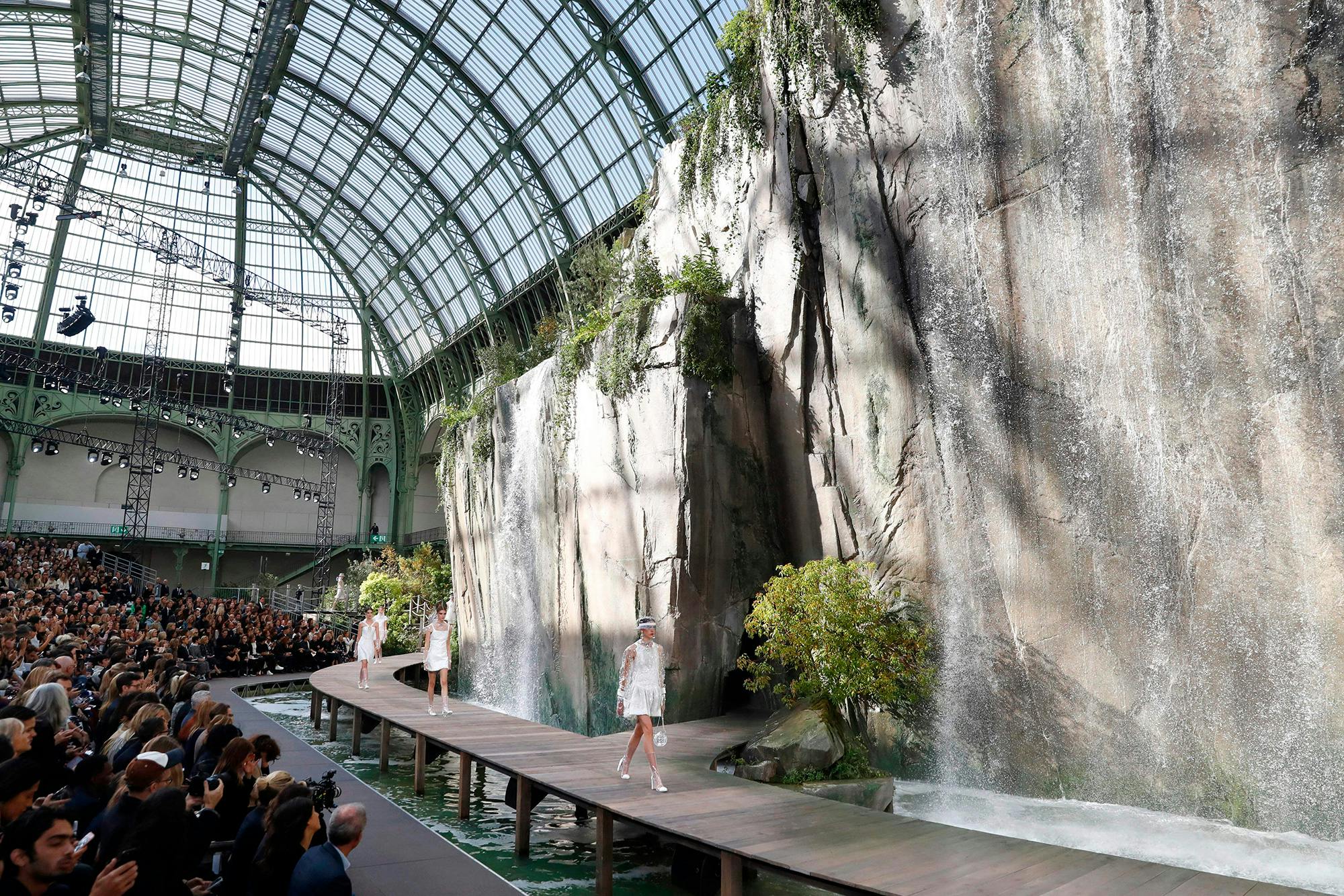 Models present creations for Chanel during the women's 2018 Spring/Summer ready-to-wear collection fashion show in Paris, on October 3, 2017.