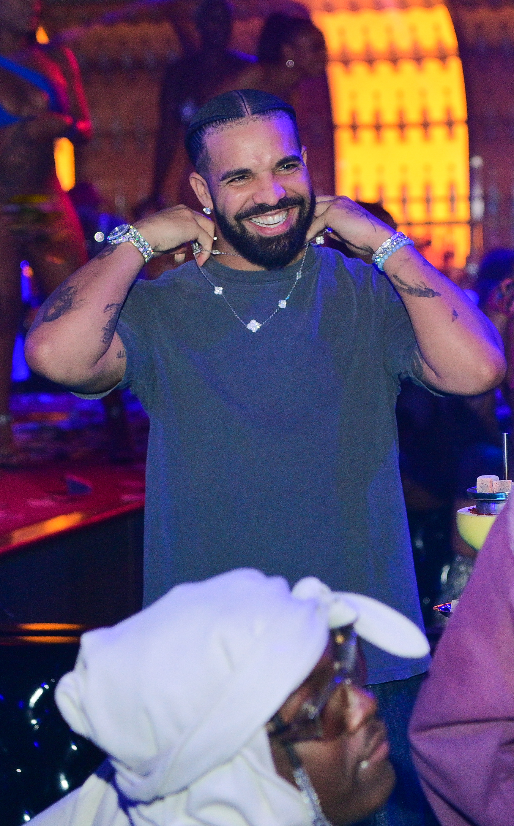 Drake wearing an Van Cleef necklace