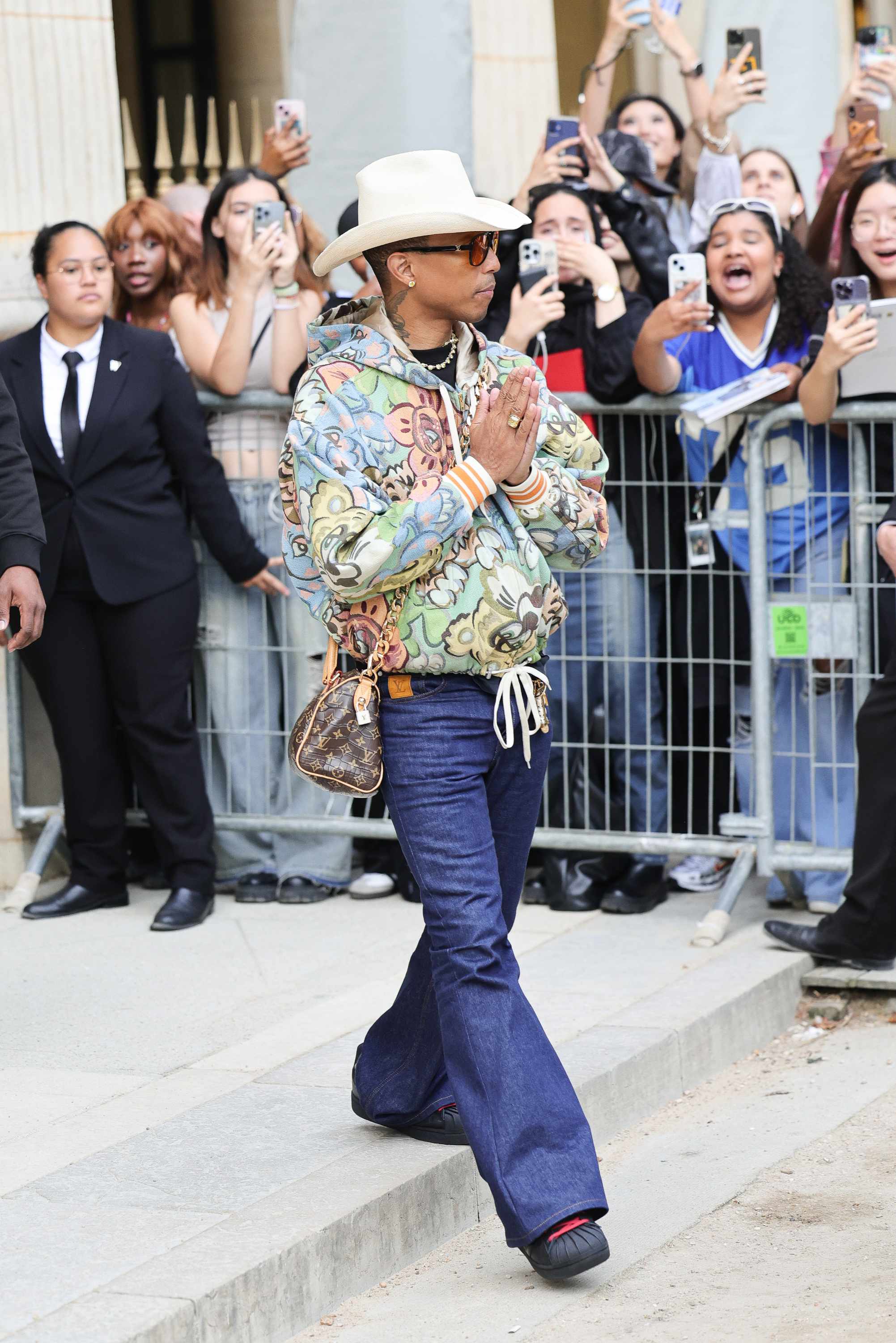 Pharrell & His $850k Louis Vuitton Bag Take Paris