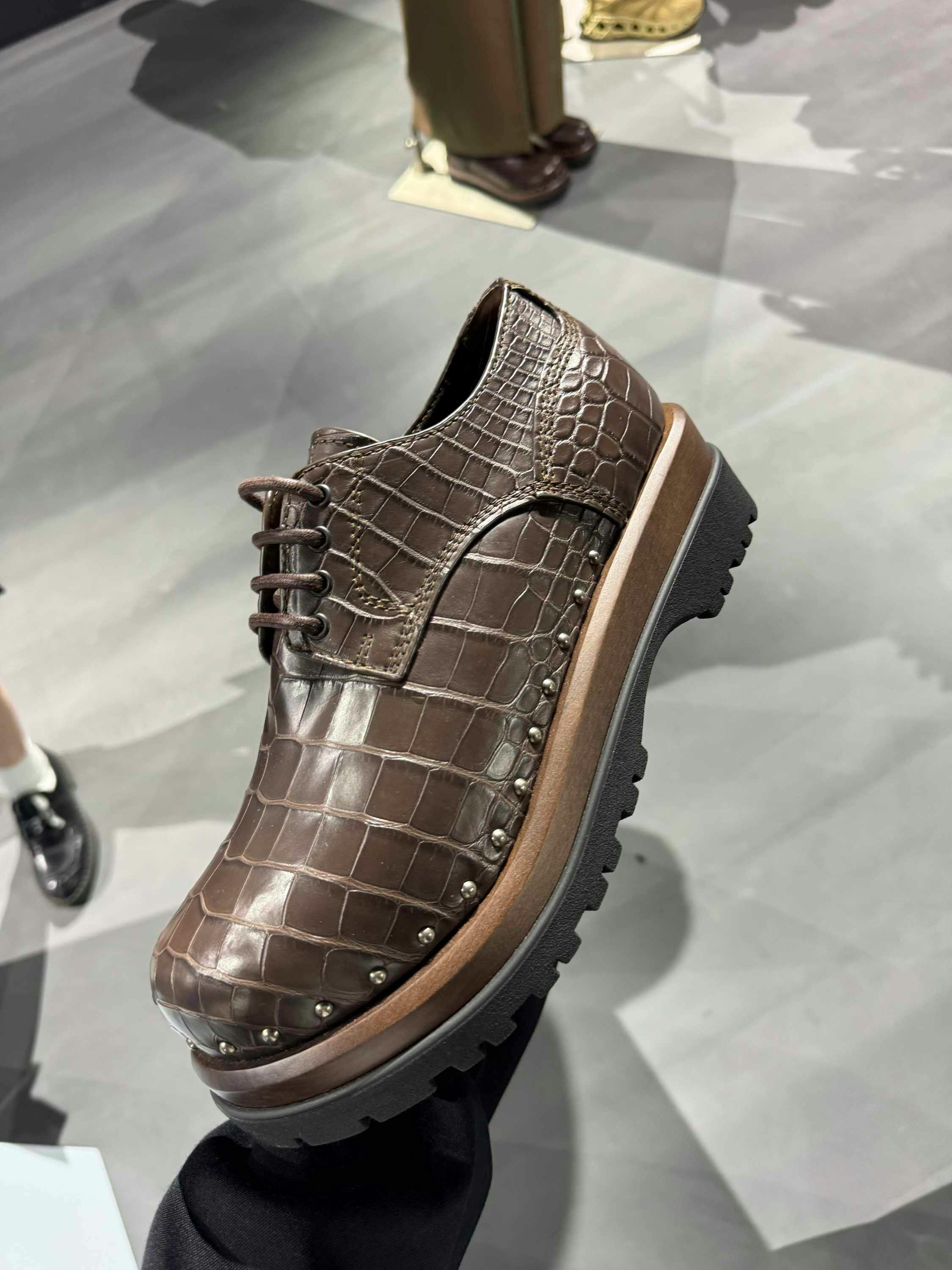 Dior's SS25 menswear hiking sneaker in beige, leather derby shoes in brown & black leather, crocodile handbags