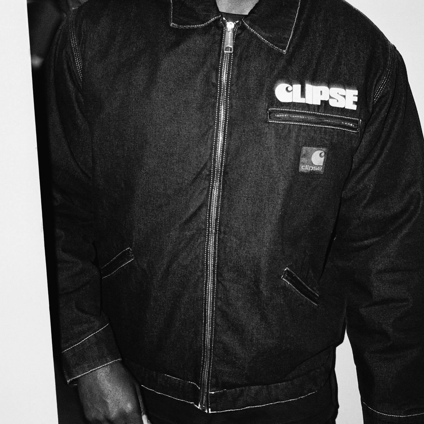 Carhartt & Clipse's collaborative work jacket in dark indigo with co-branded Carhartt logos and patches