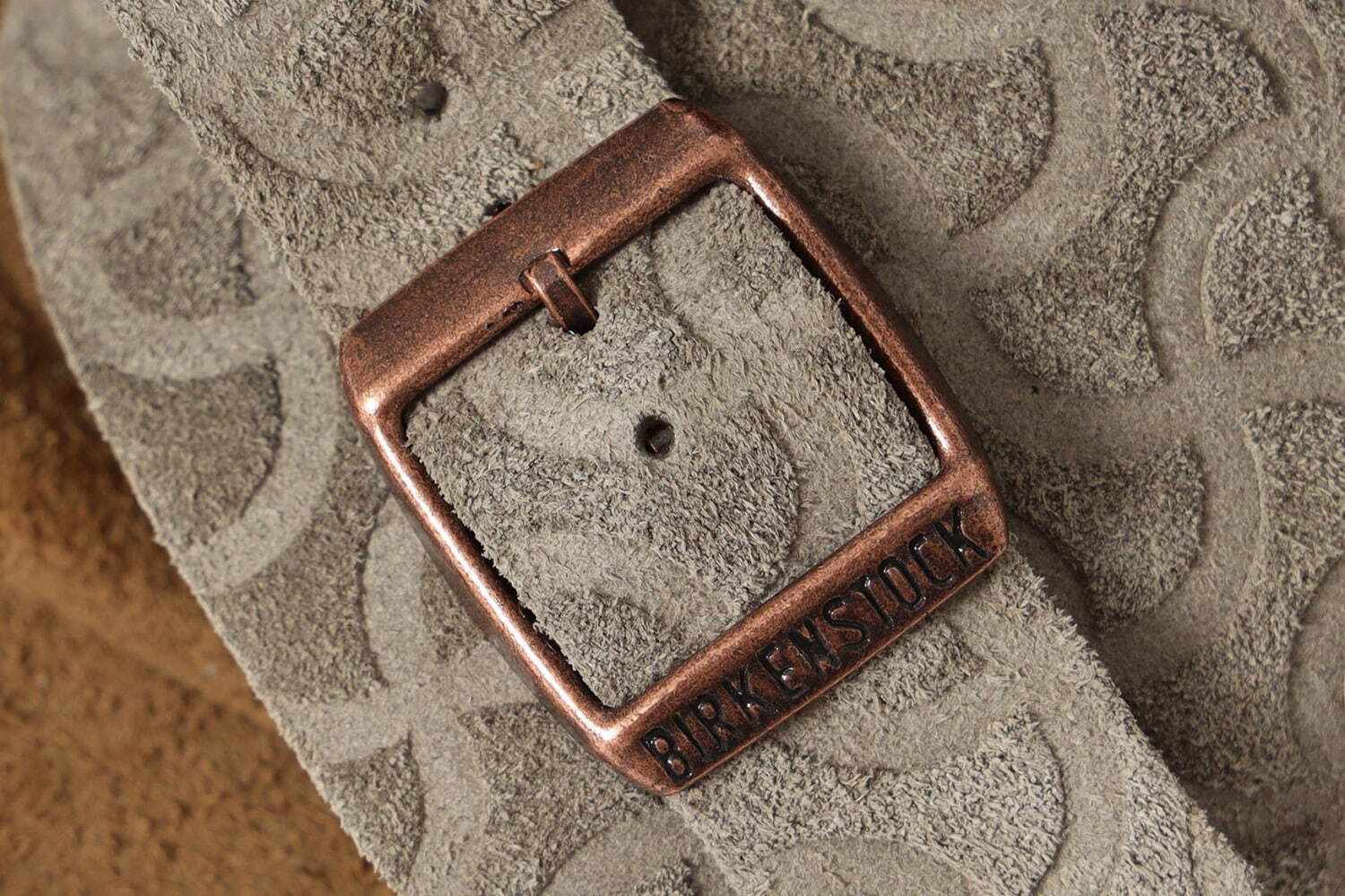 BEAMS' beige suede Birkenstock Zurich slide sandal with embossed swirling pattern and black sole