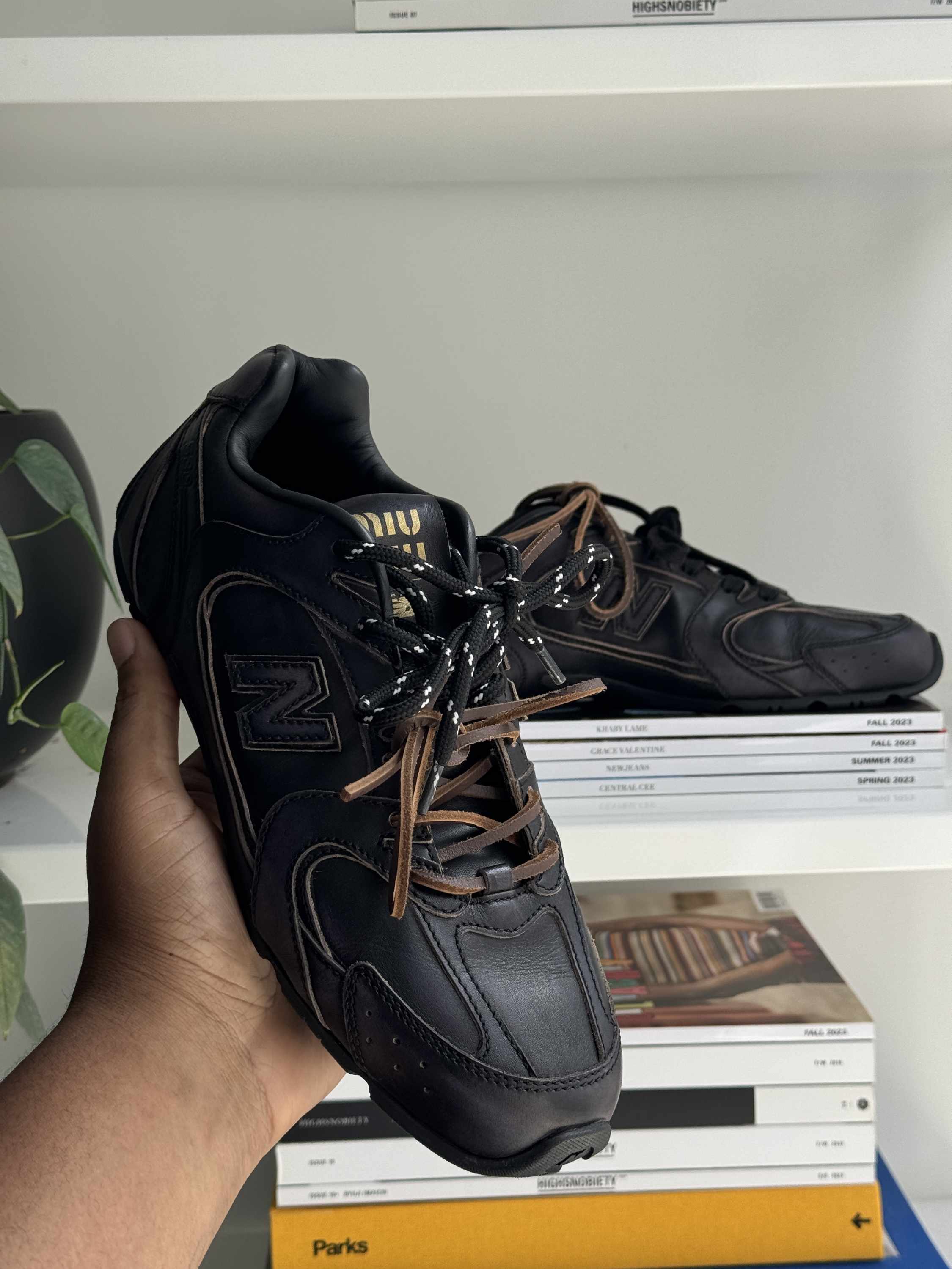 Miu Miu's New Balance 530 sneaker collab in black leather with two laces