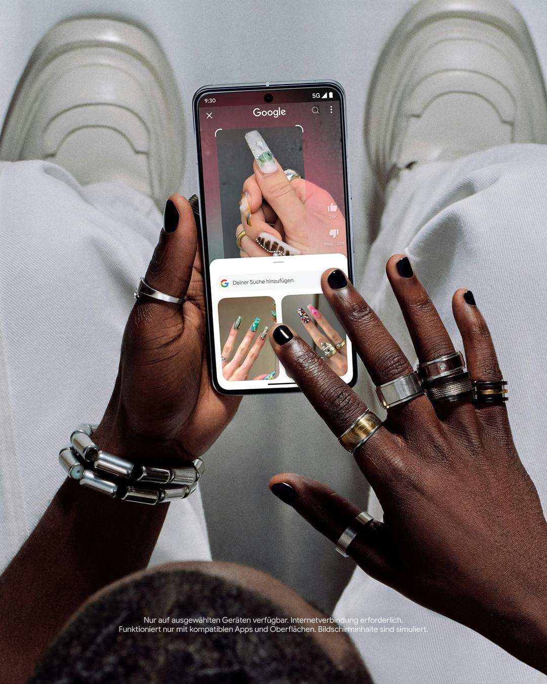 Close-up of a man's hands holding a phone and searching the web for nail art