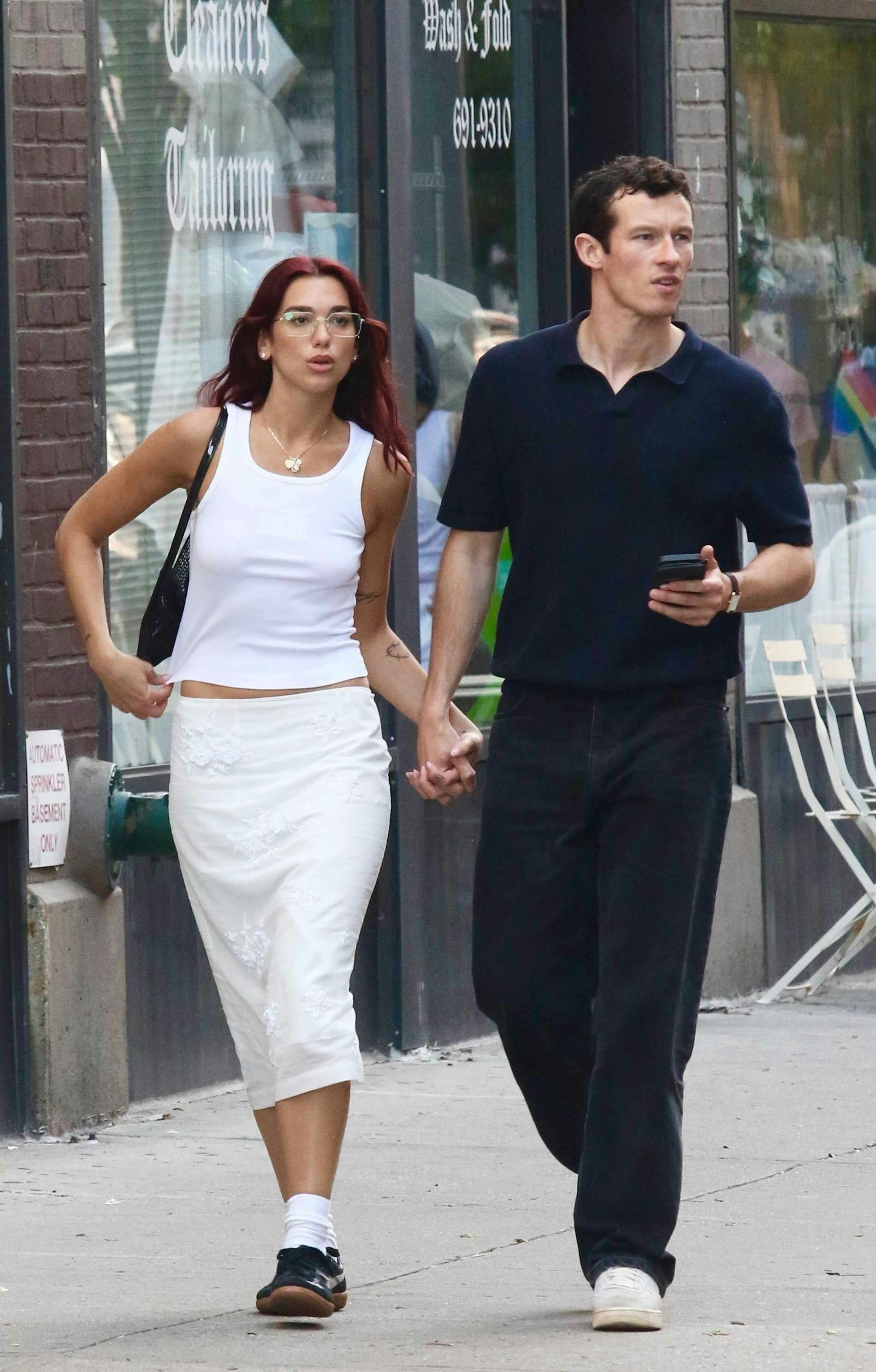 Dua Lipa wears a white ribbed tank top with Callum Turner in New York