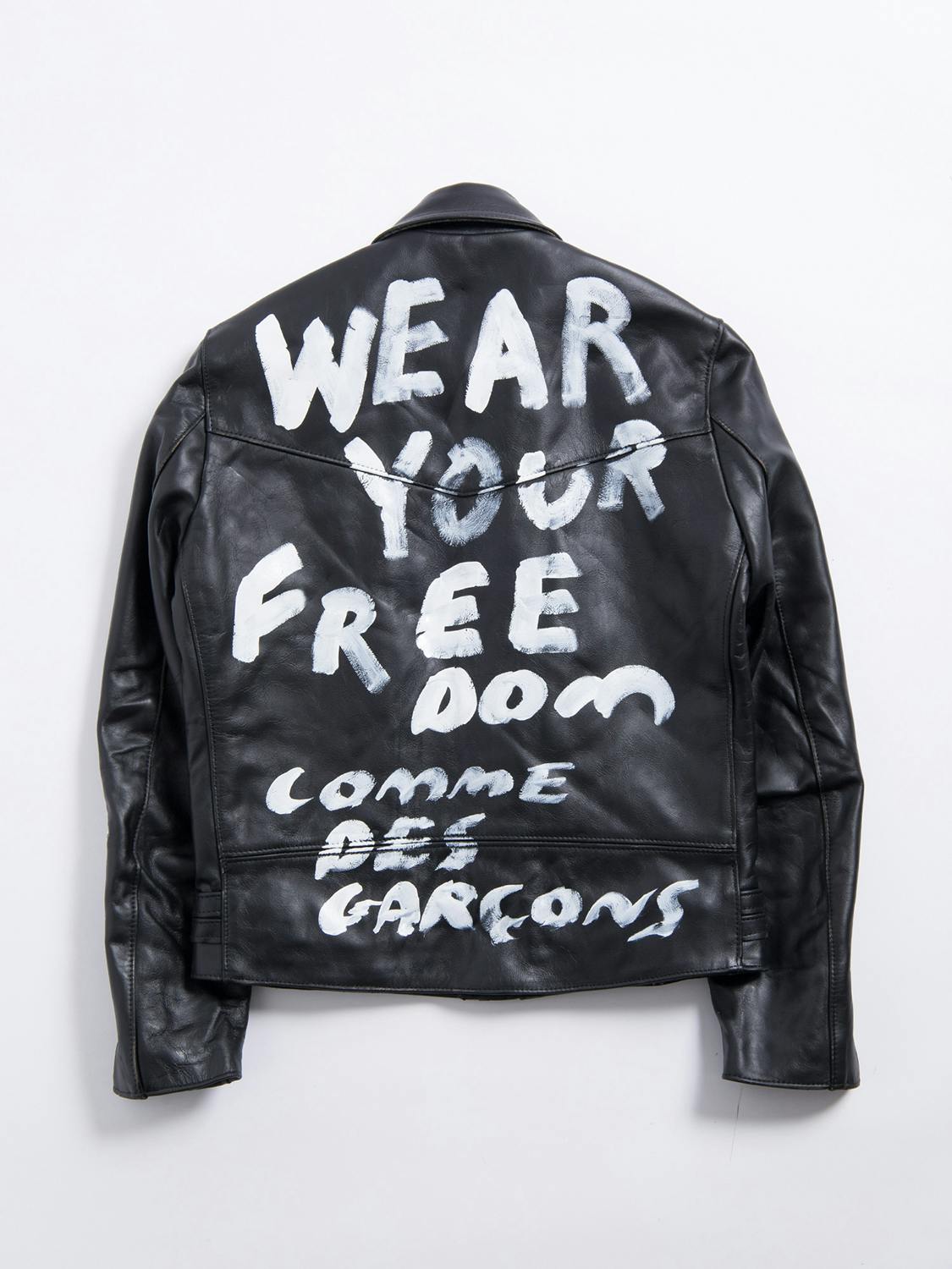 Comme des Garcons' Lewis Leathers jacket collab in black with white text