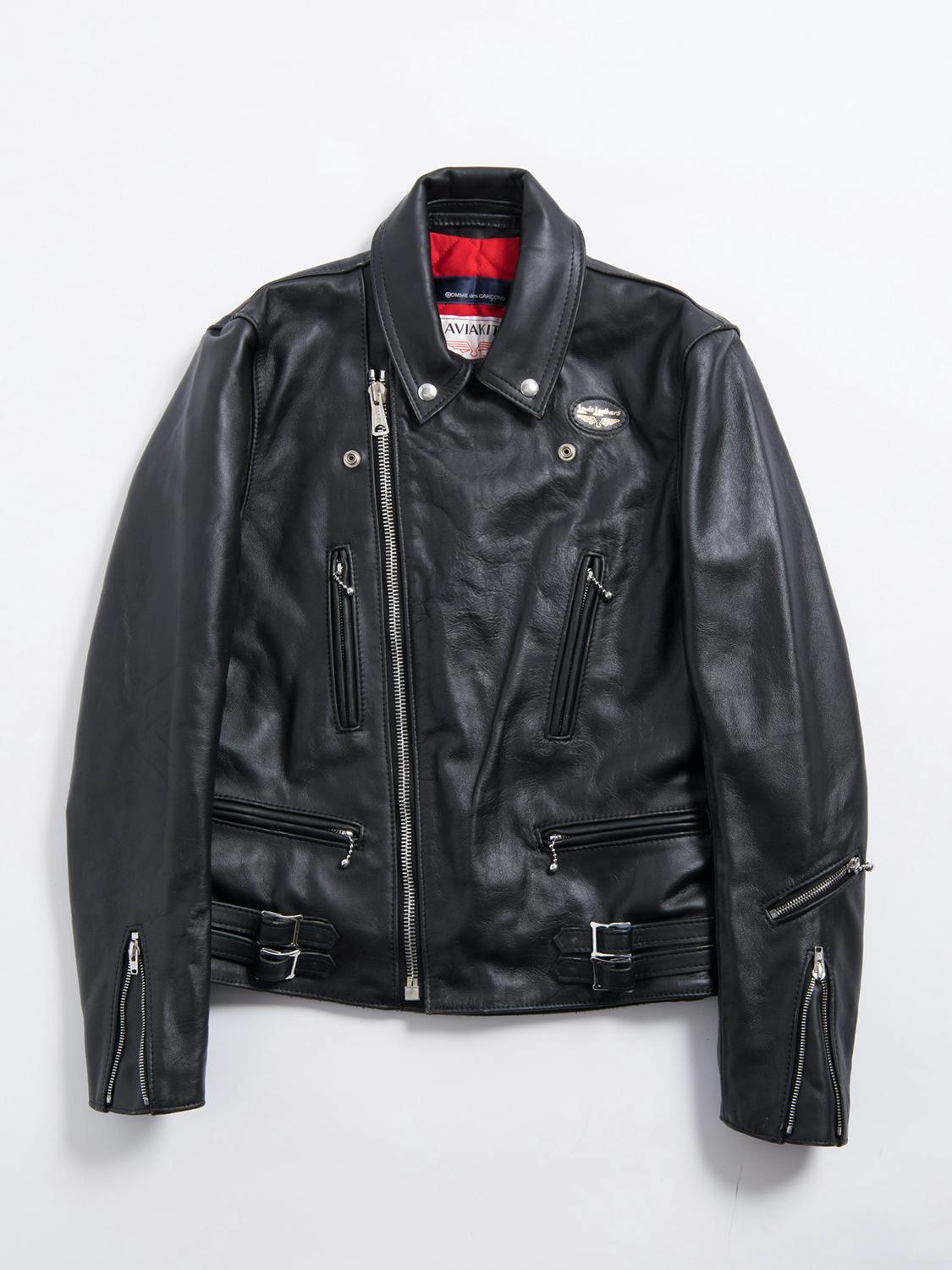 Comme des Garcons' Lewis Leathers jacket collab in black with white text