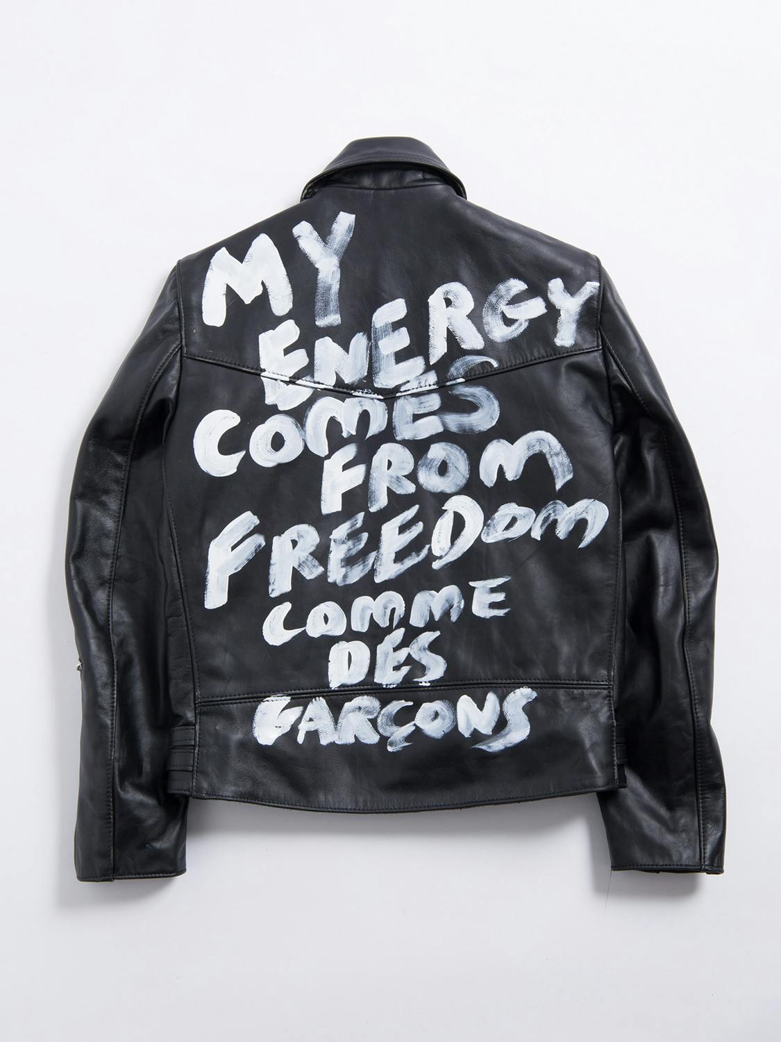 Comme des Garcons' Lewis Leathers jacket collab in black with white text