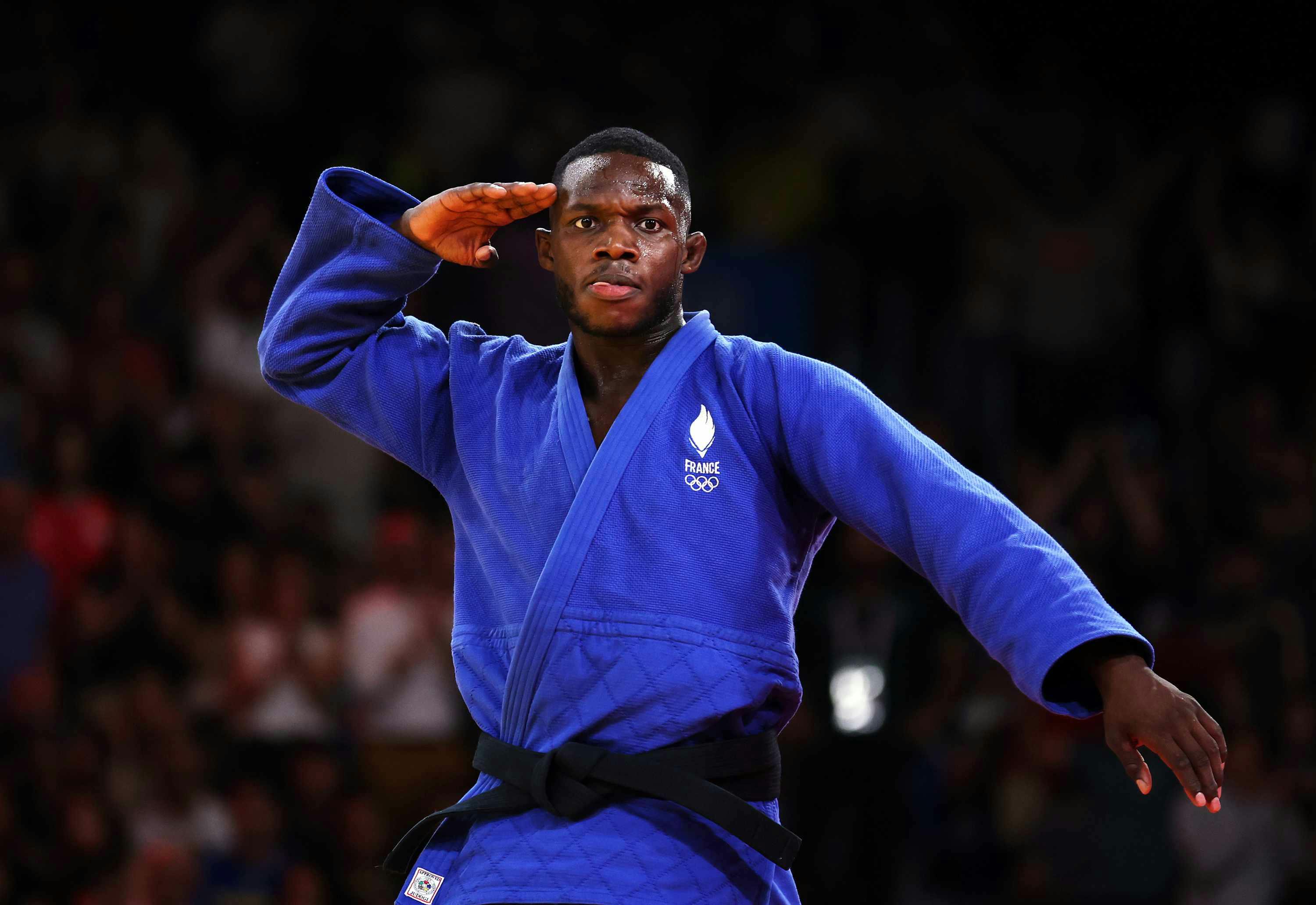 French judoka Maxime-Gaël Ngayap Hambou wears a blue gi outfit at the 2024 Olympics