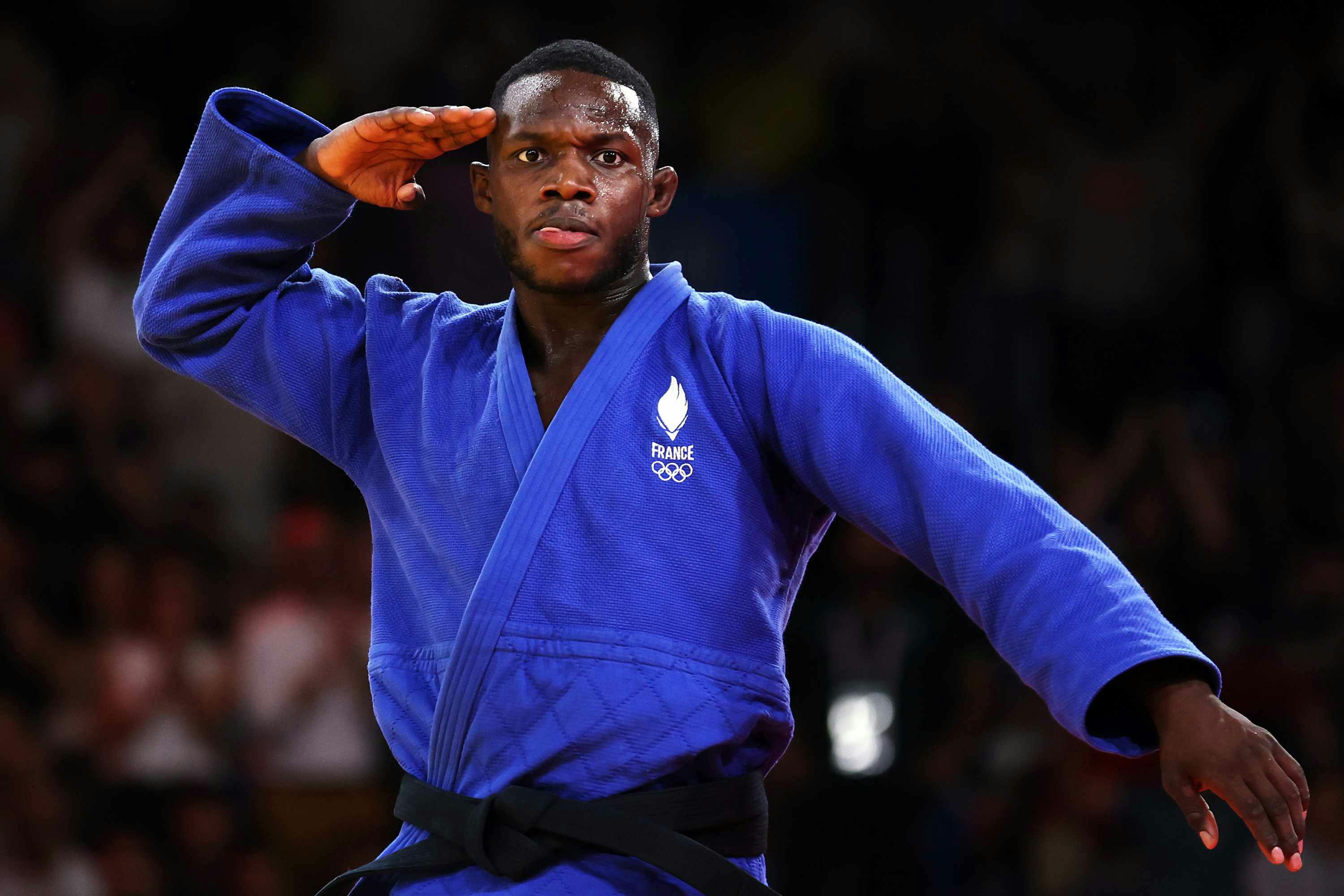 French judoka Maxime-Gaël Ngayap Hambou wears a blue gi outfit at the 2024 Olympics