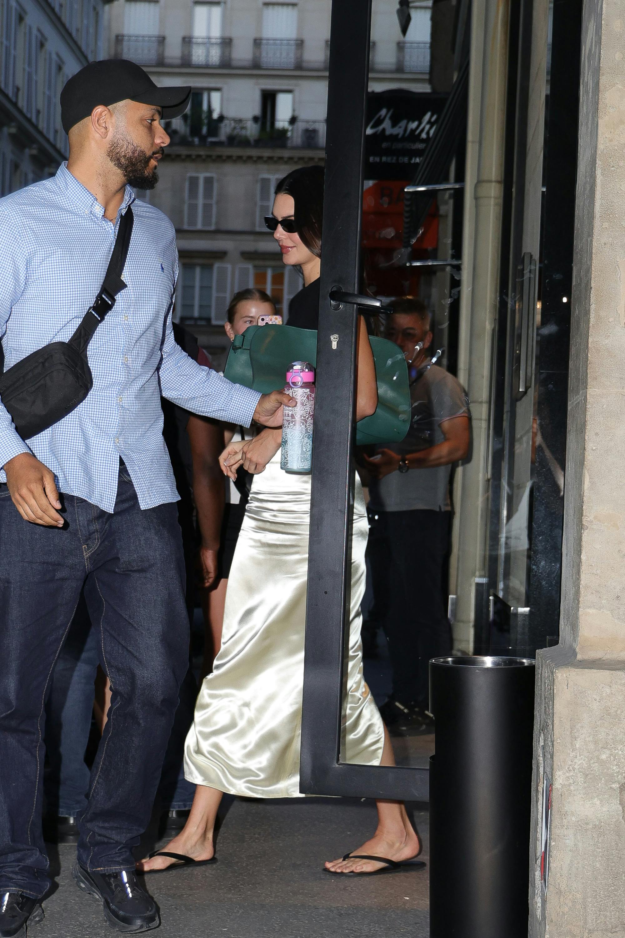 Kendall Jenner wearing The Row Margaux EW Clutch in Paris