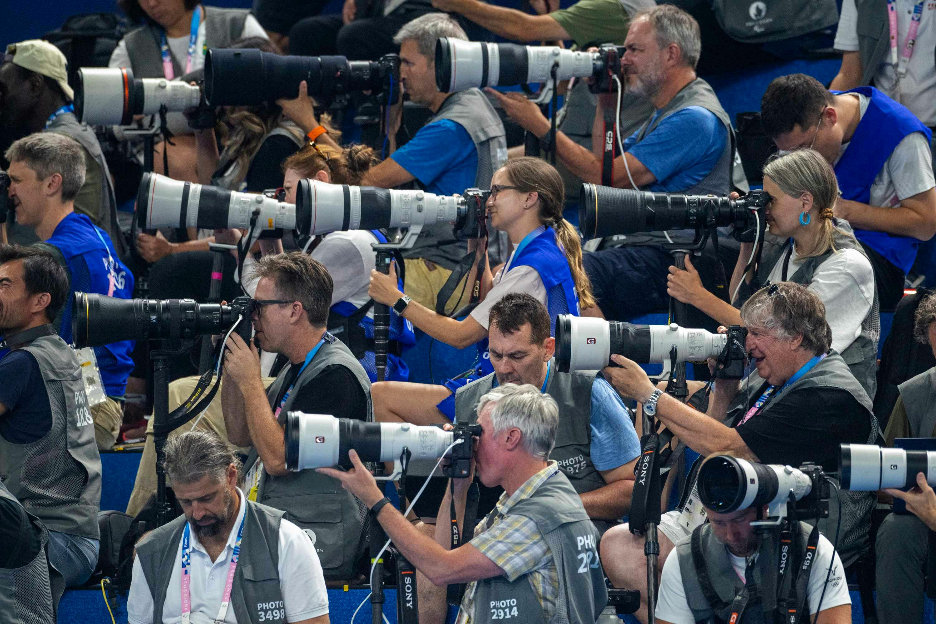 Olympics 2024 photographers wear brown vests